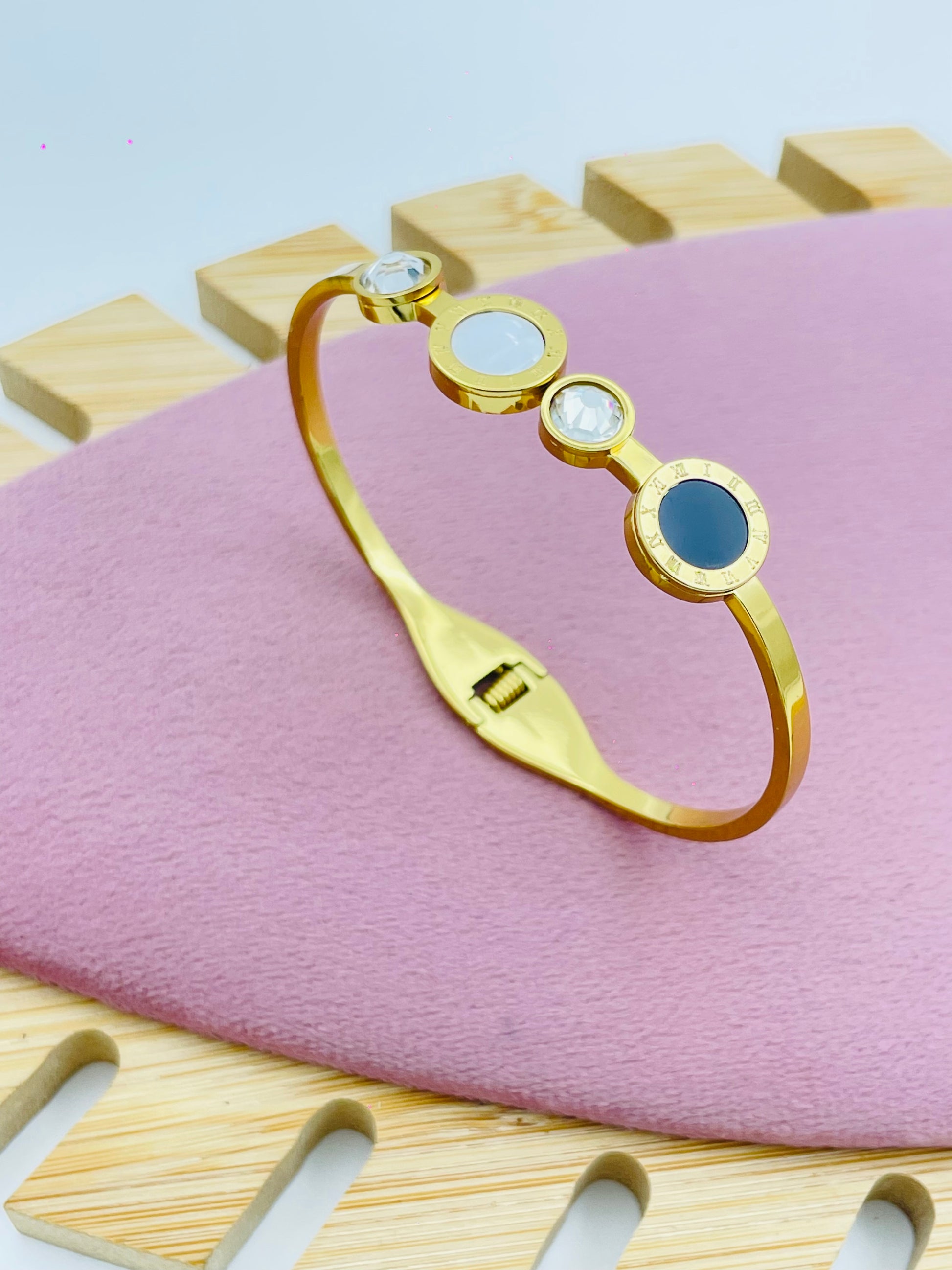 Elegant Gold Bangle Bracelet with Circular Stones