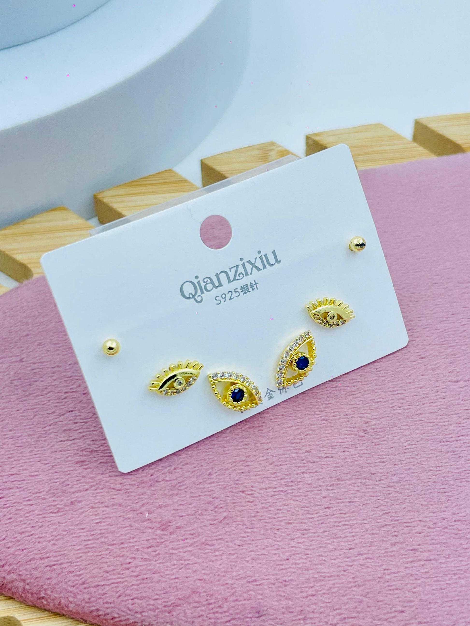 Gold Eye Stud Earrings with Blue Stone