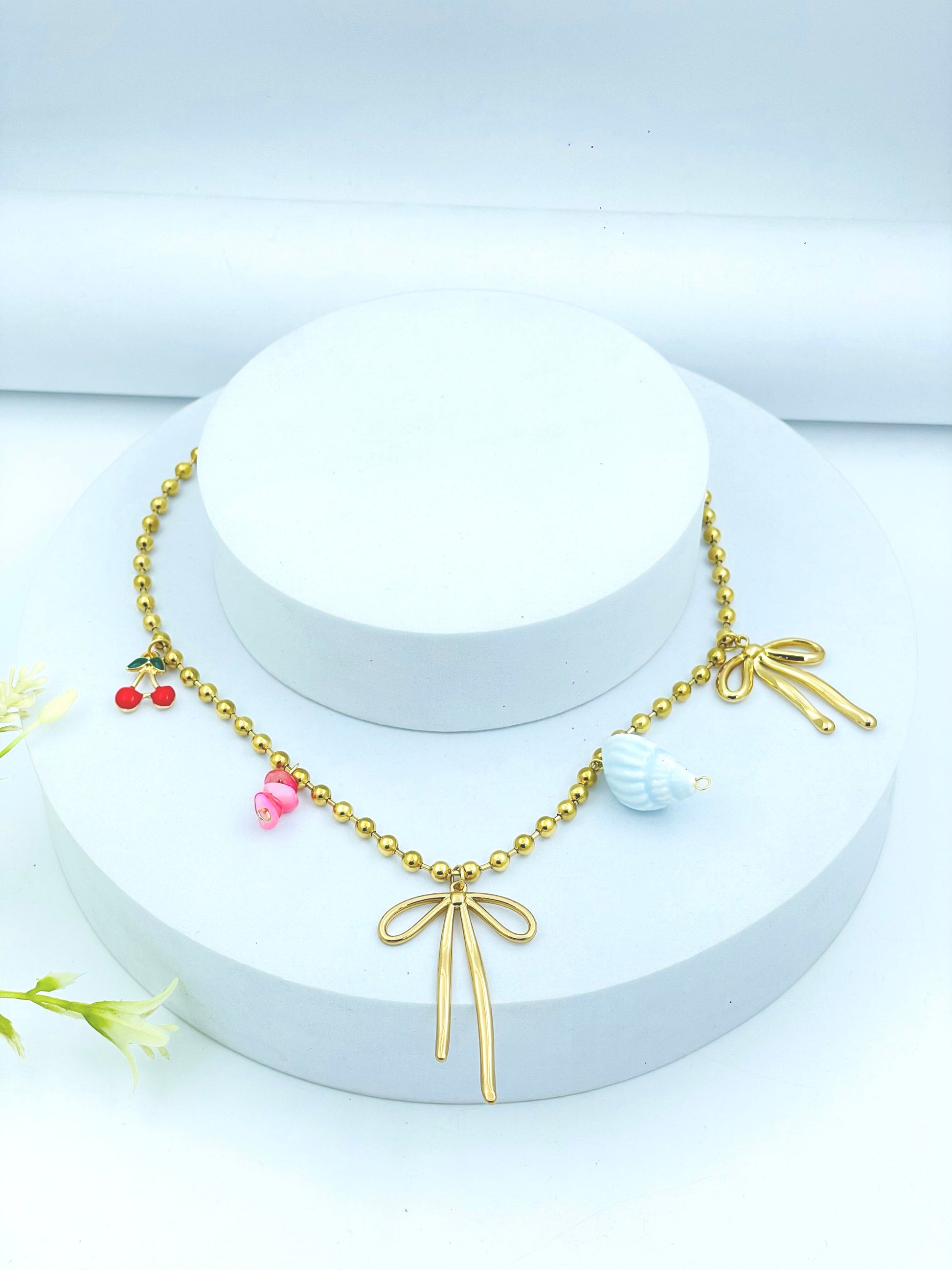 Chic Gold Bead Necklace with Playful Charms  Elegant Jewelry