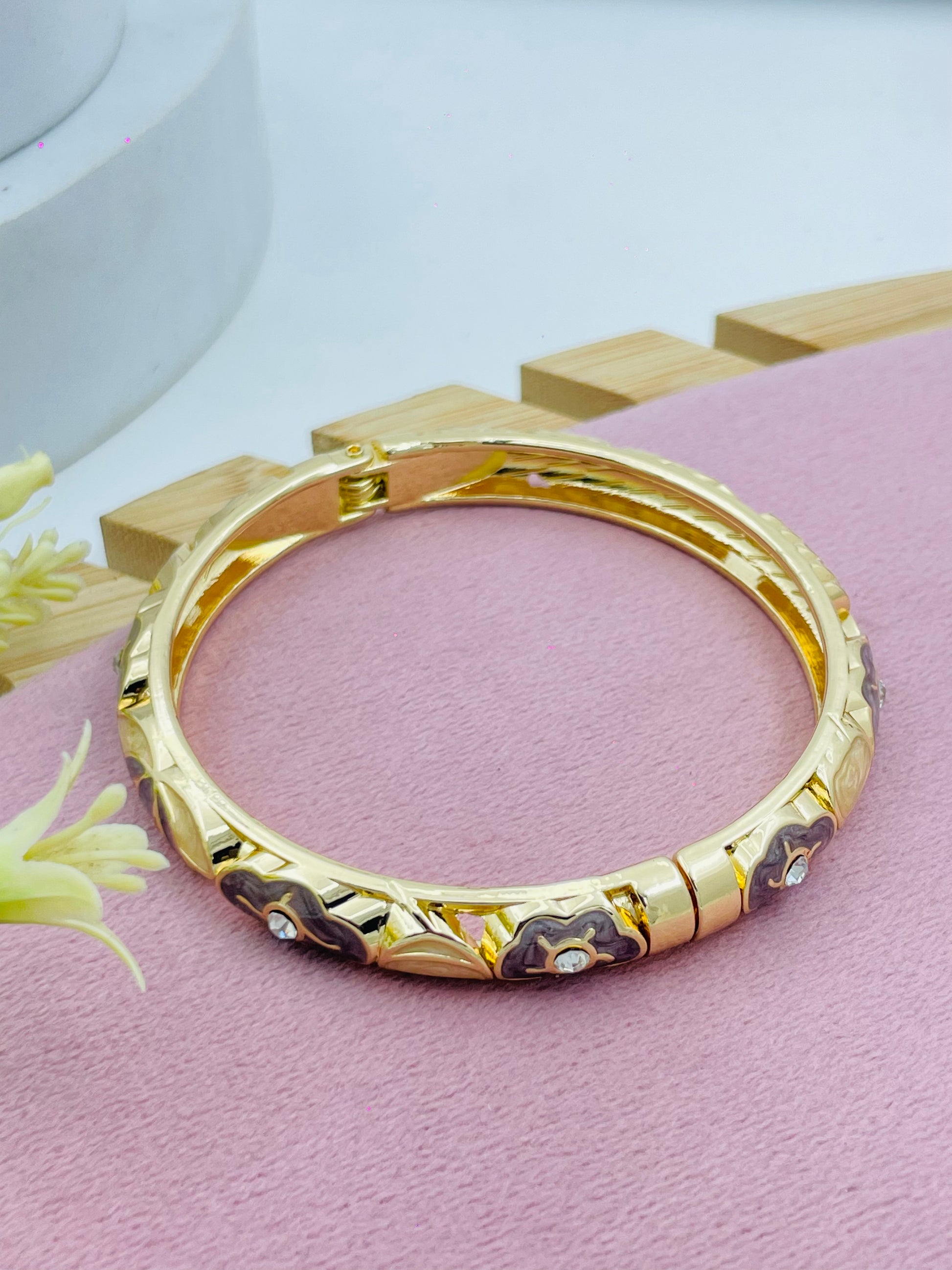 Elegant Gold Bangle with Floral Design  Timeless Jewelry