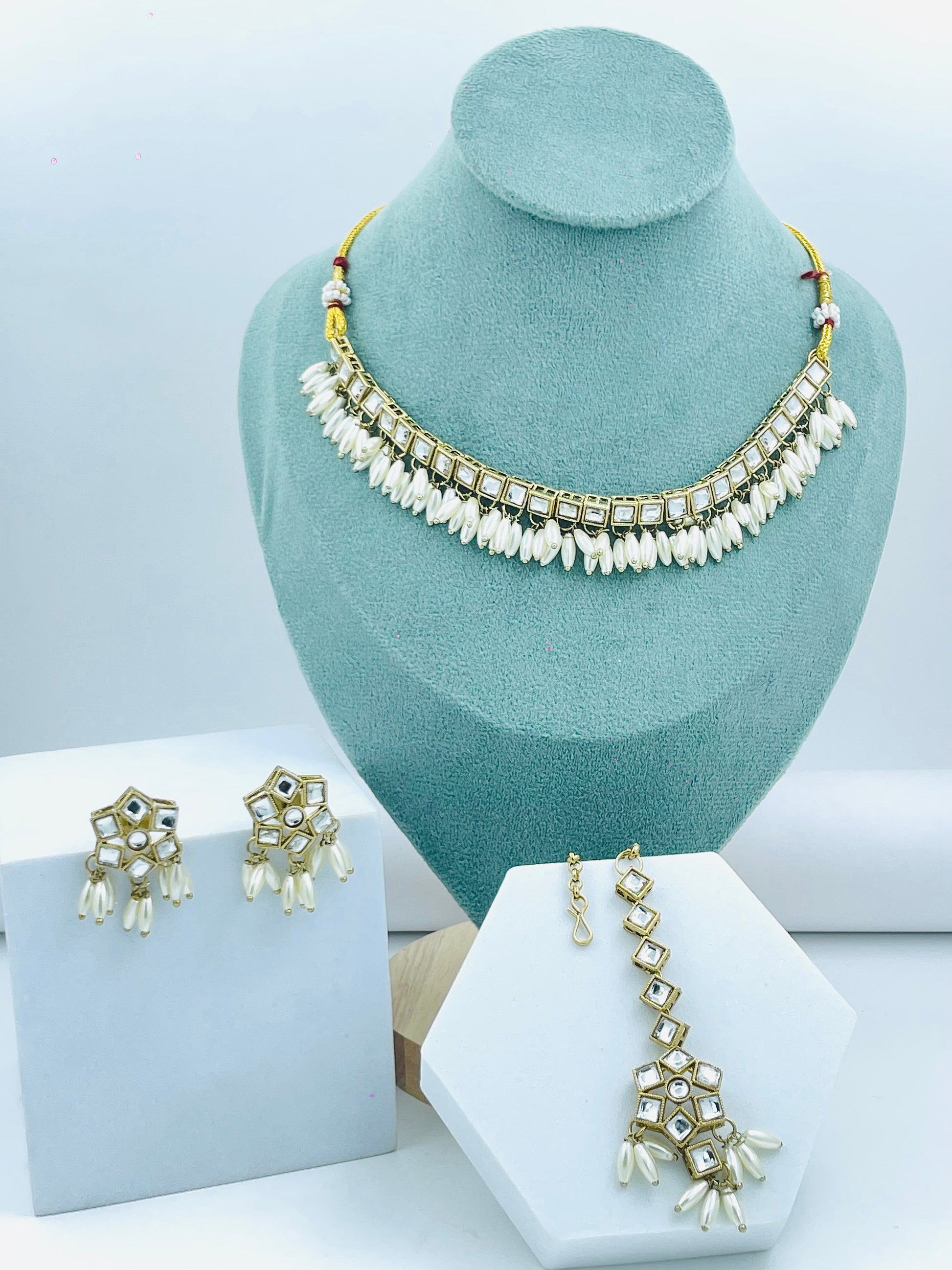 Elegant Pearl and Kundan Necklace Set with Earrings and Maang Tikka