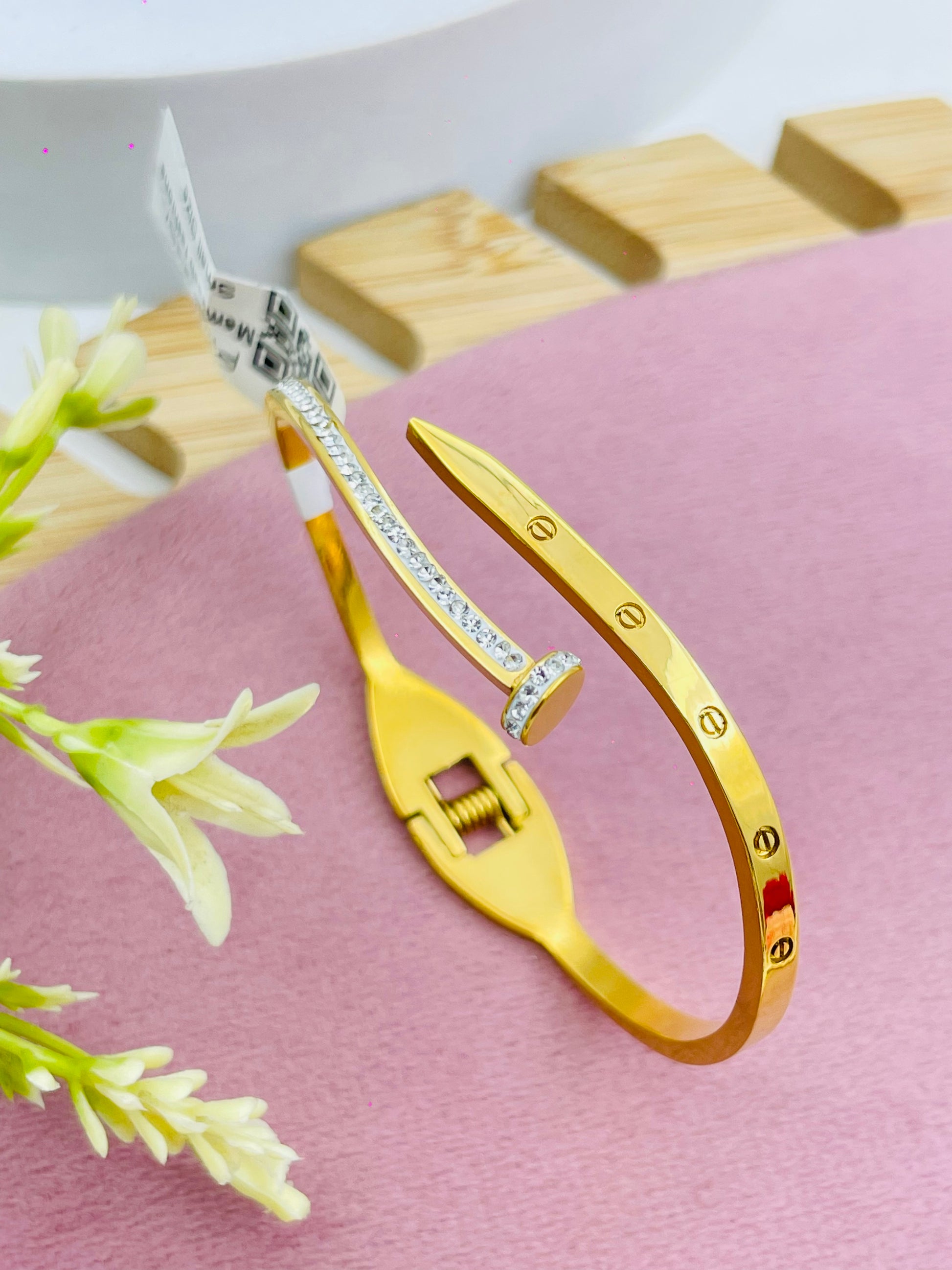 Elegant Gold and Silver Nail Bracelet with Gem Accents