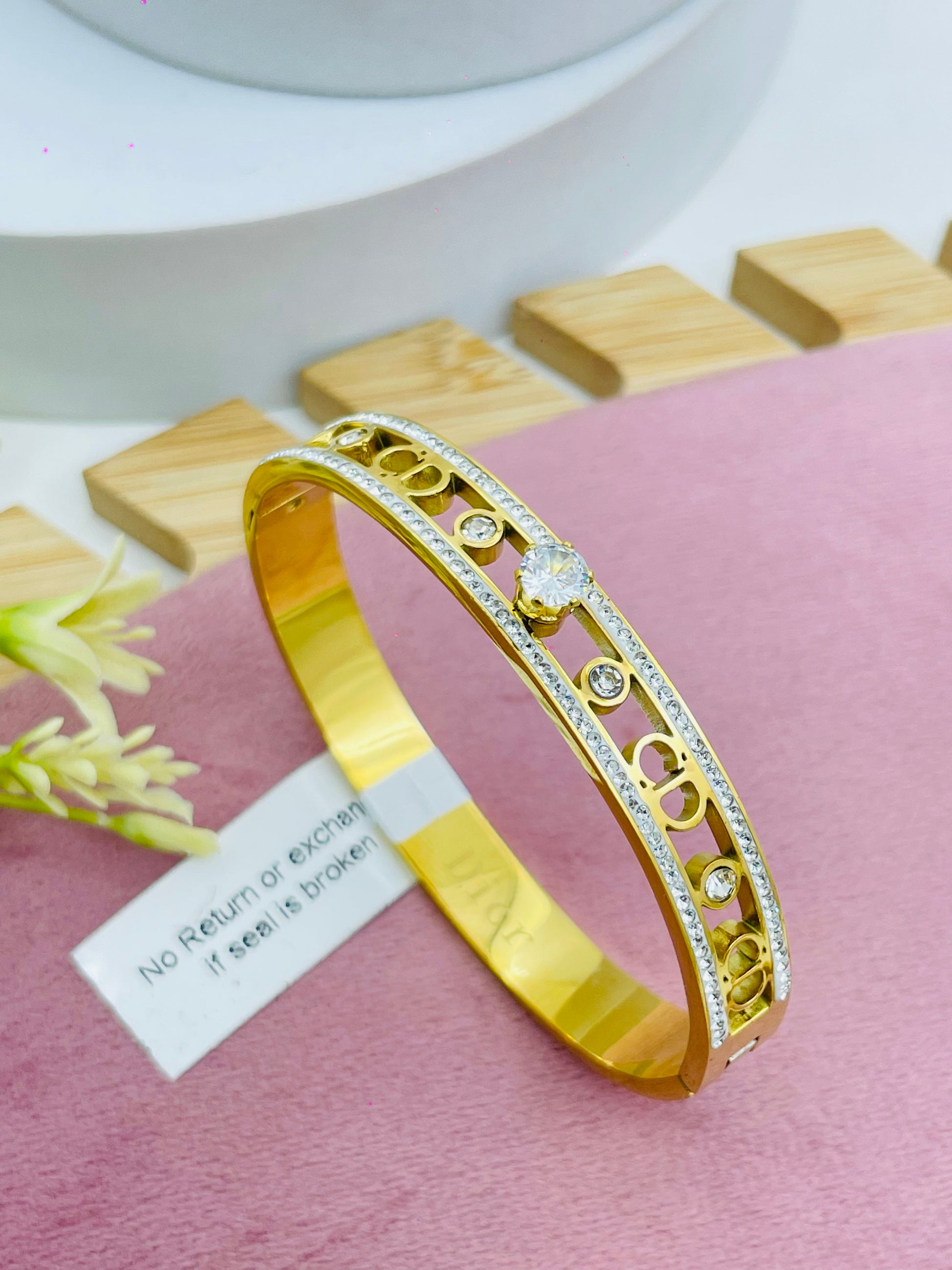 Elegant Gold Bangle with Diamond Accents