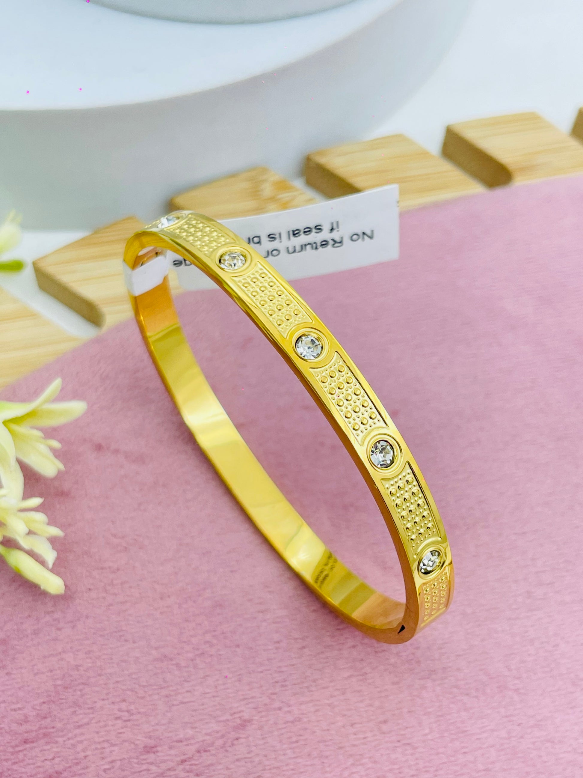 Elegant Gold Bangle with Diamond Accents