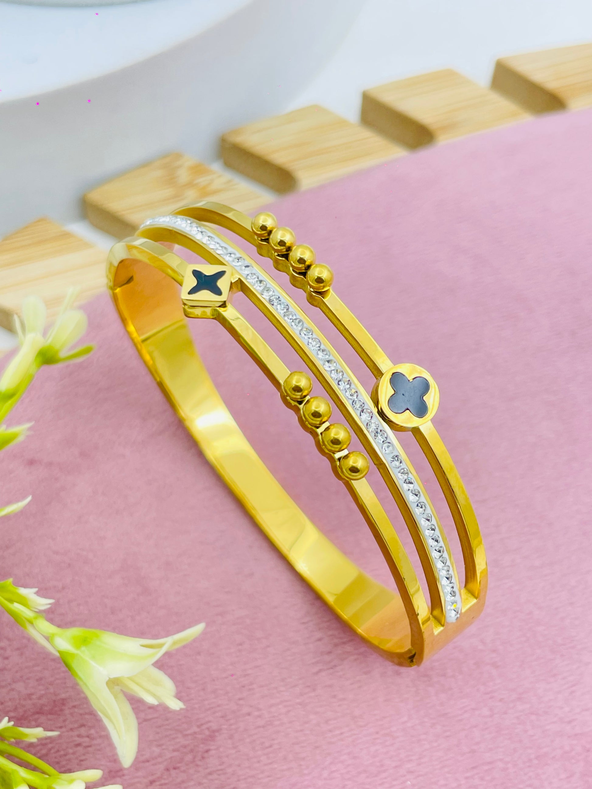 Stylish GoldPlated Bangle with Unique Black Accents