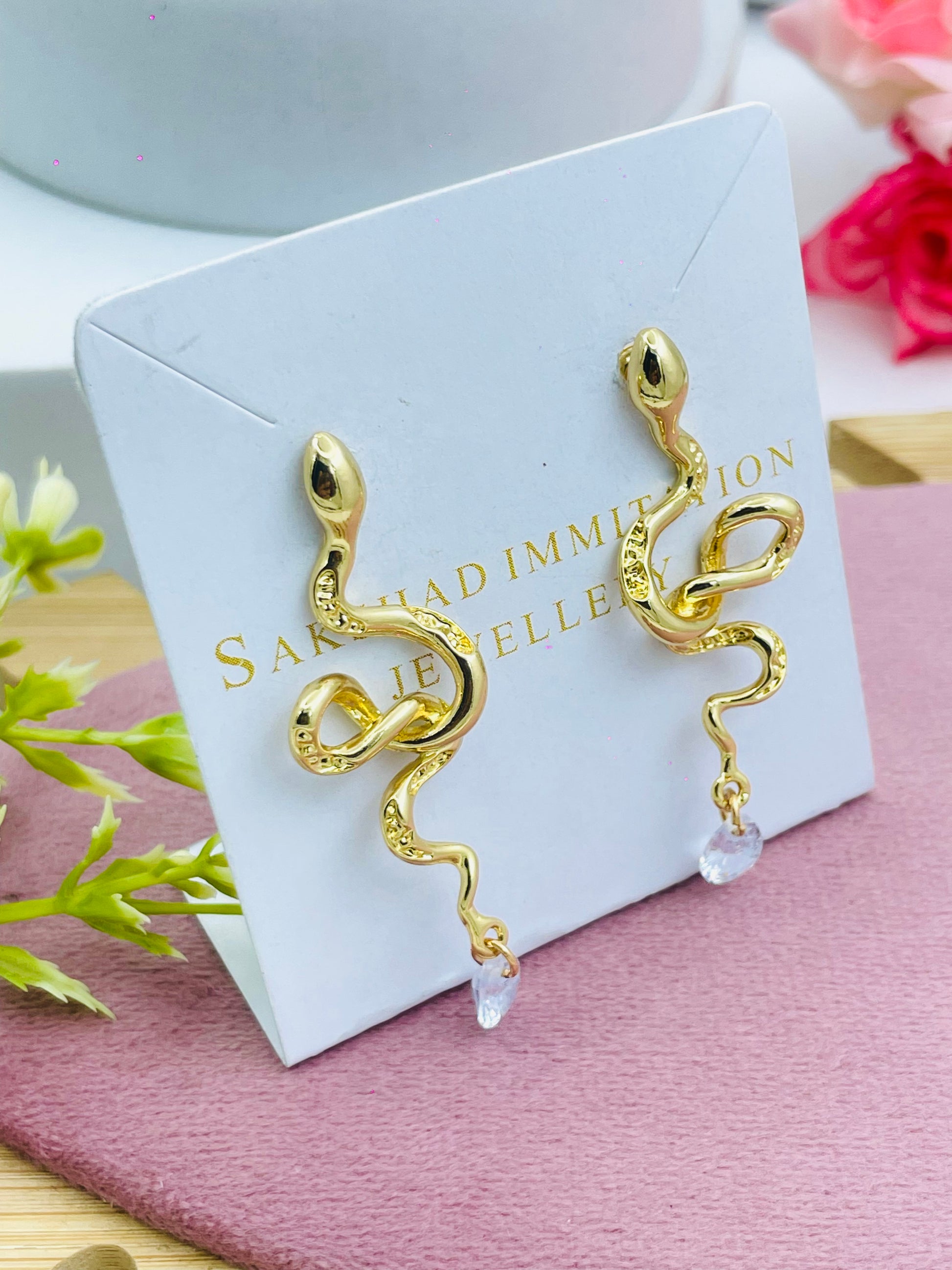 Elegant Gold Snake Design Earrings with Crystal Drops
