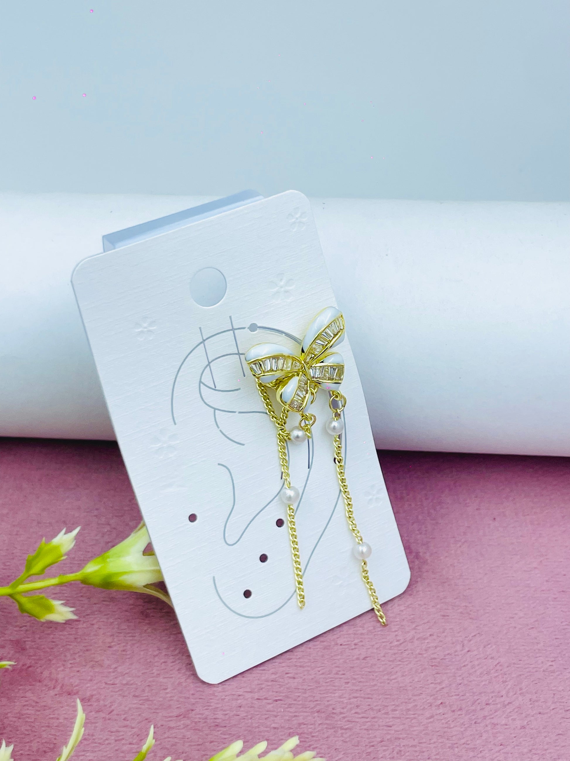 Elegant Gold Bow Earrings with Chains and Gems