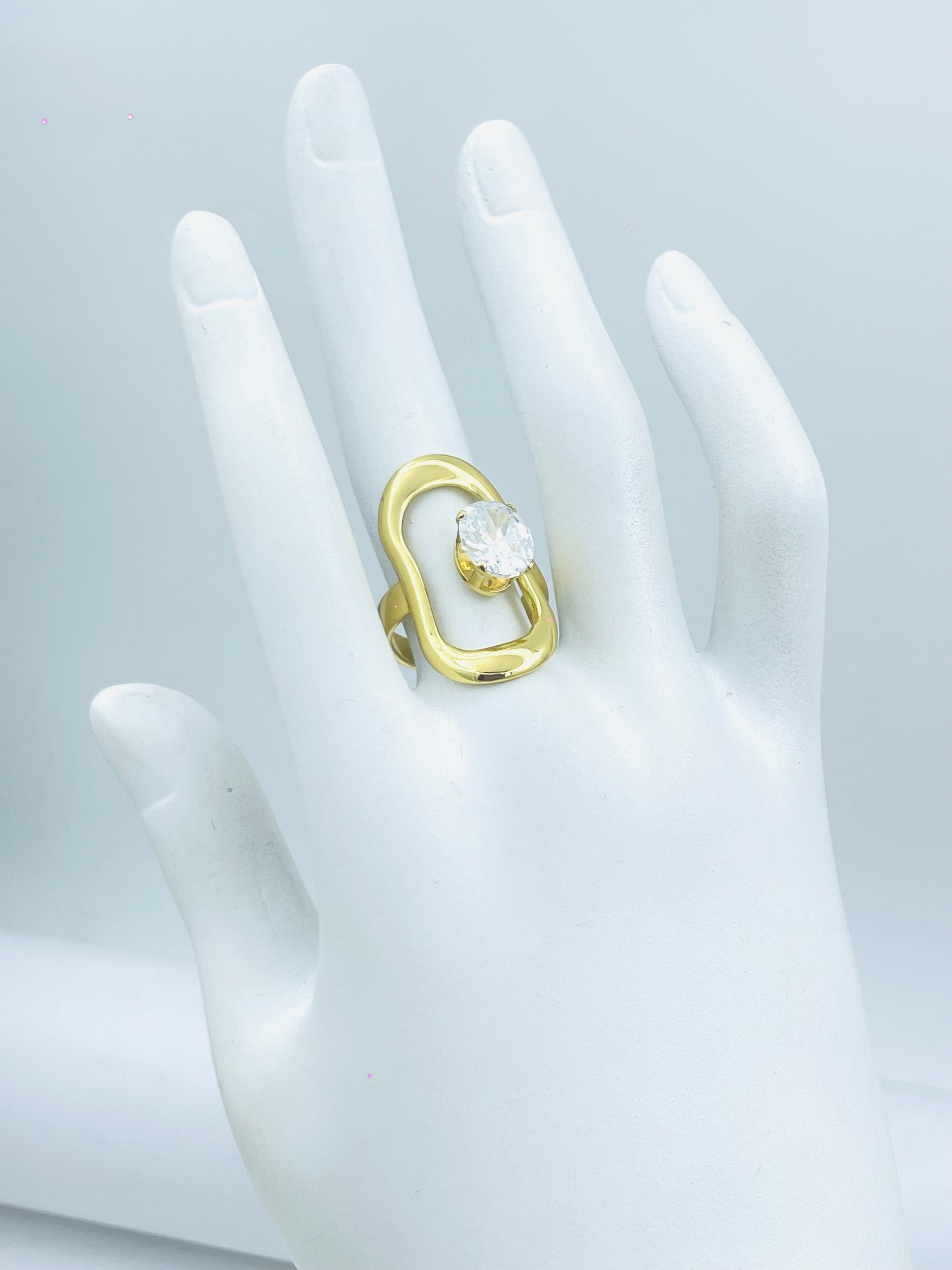 Elegant Gold Swirl Ring with Clear Gemstone