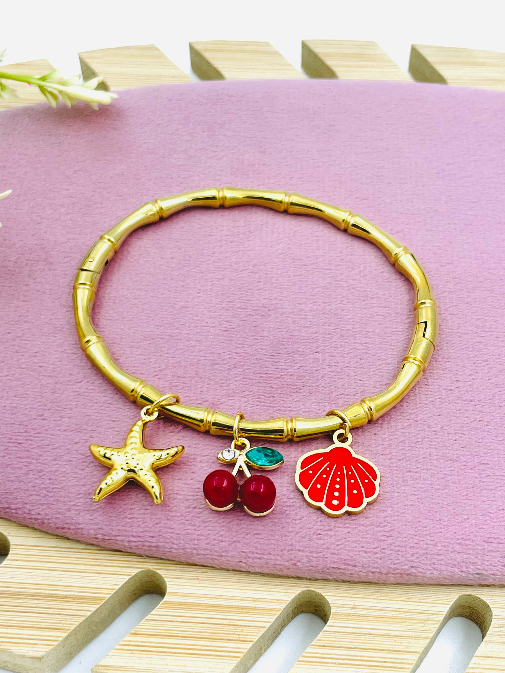 Gold Charm Bangle Bracelet with Starfish and Cherry Charms