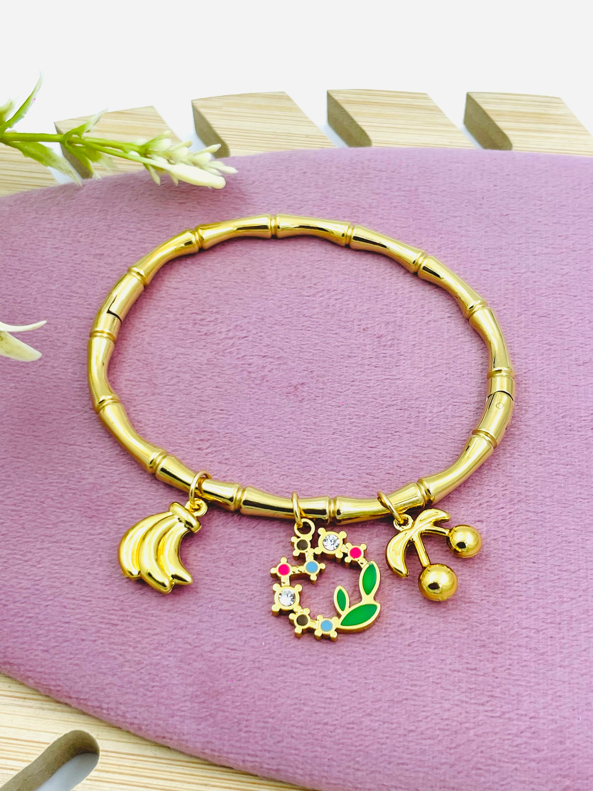 Elegant Gold Tone Charm Bracelet with Fruit Accents