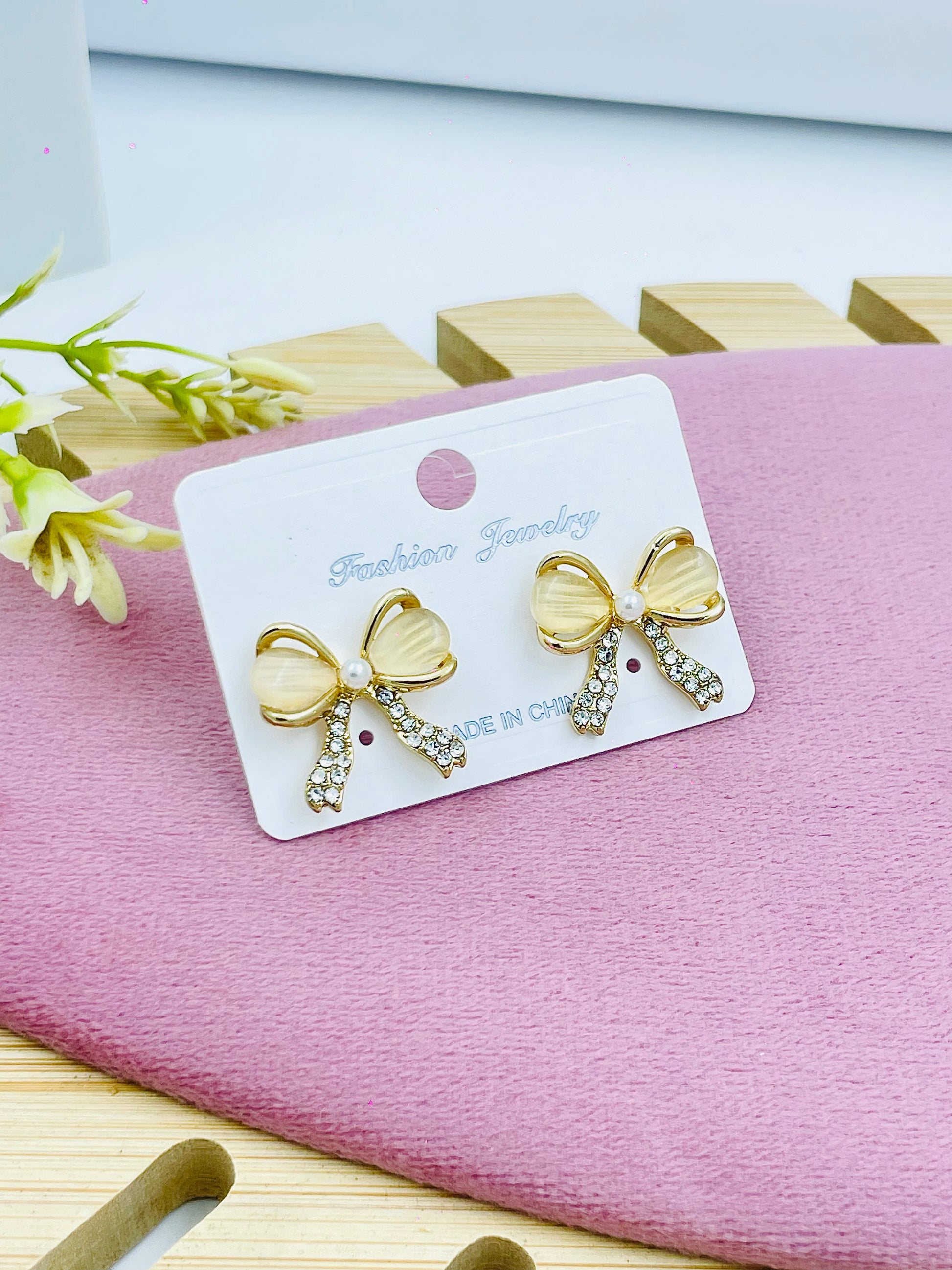 Elegant Gold Bow Earrings with Sparkling Rhinestones