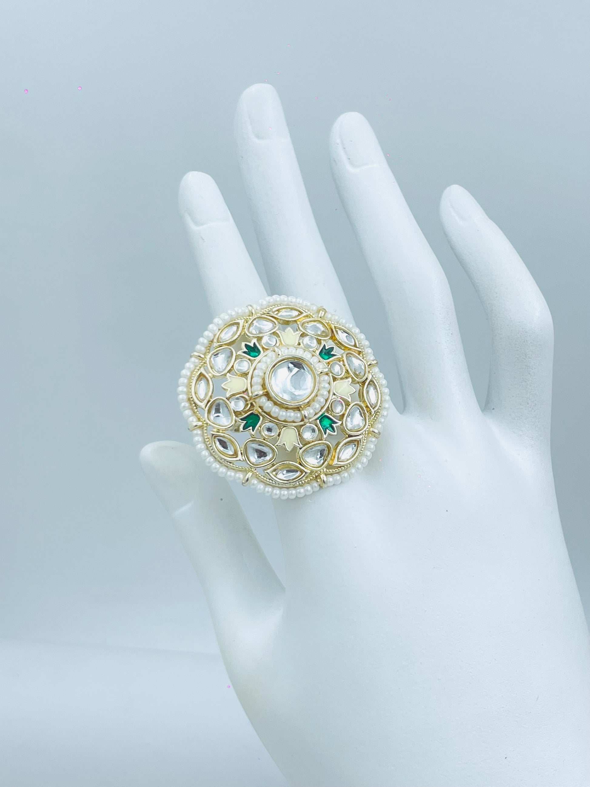 Elegant Pearl Encrusted Ring with Green Accents