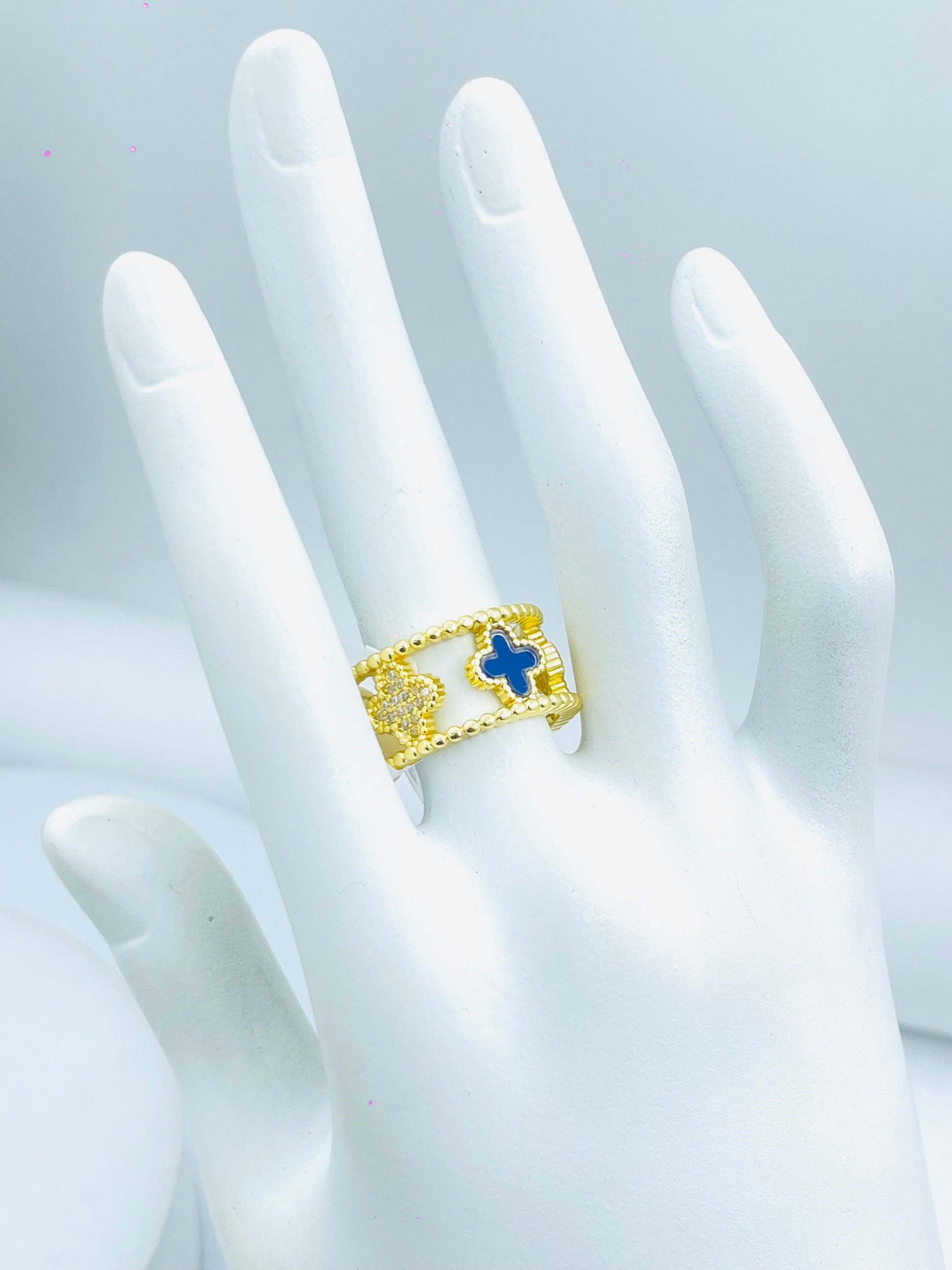 Elegant Gold Ring with Blue Cross Design