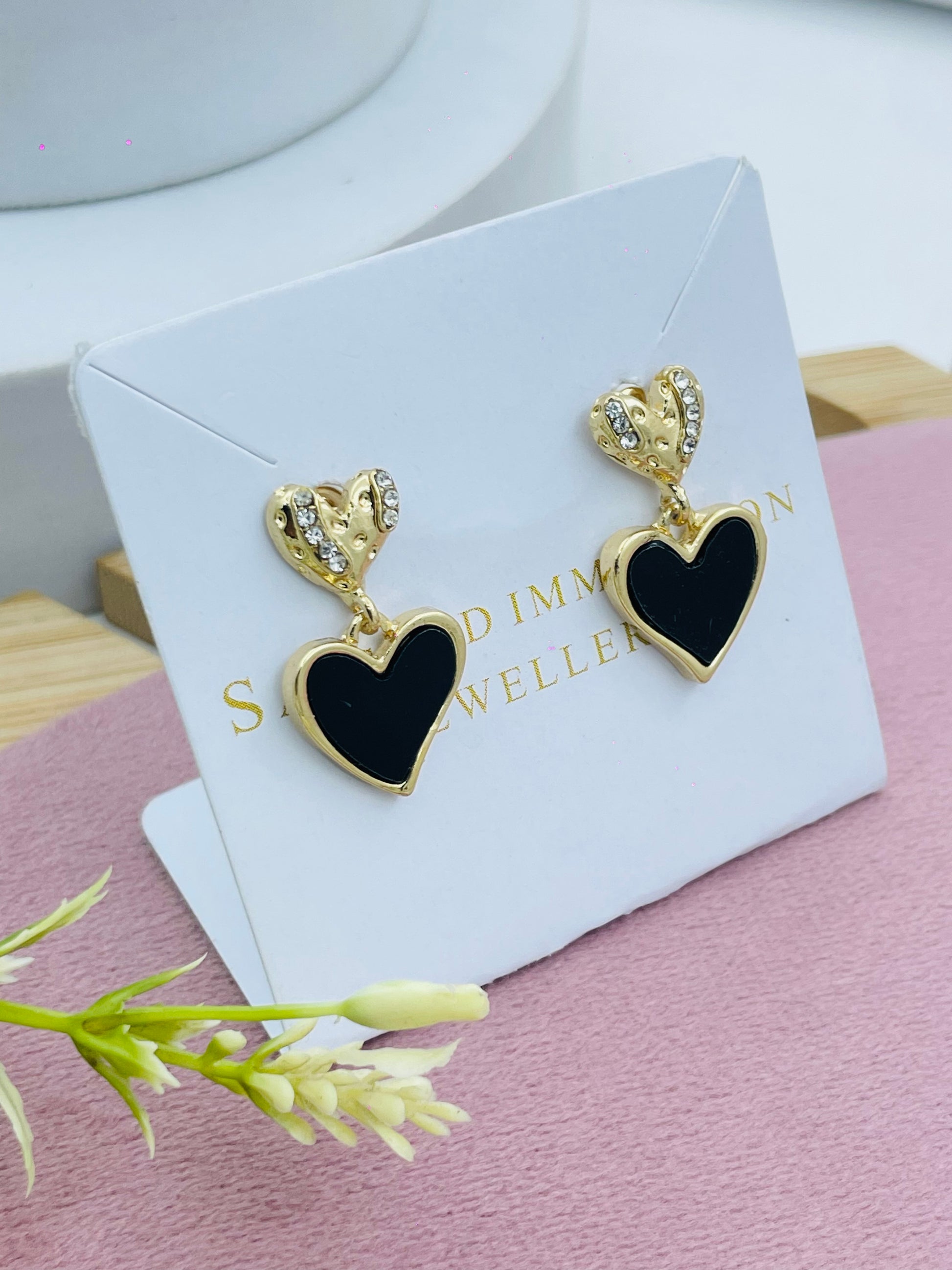 Elegant Gold and Black Heart Earrings with Diamond Accents