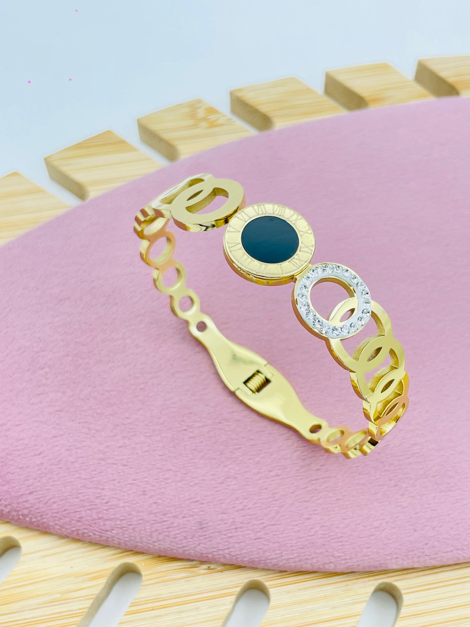 Stylish Gold Bracelet with Black and White Circular Elements