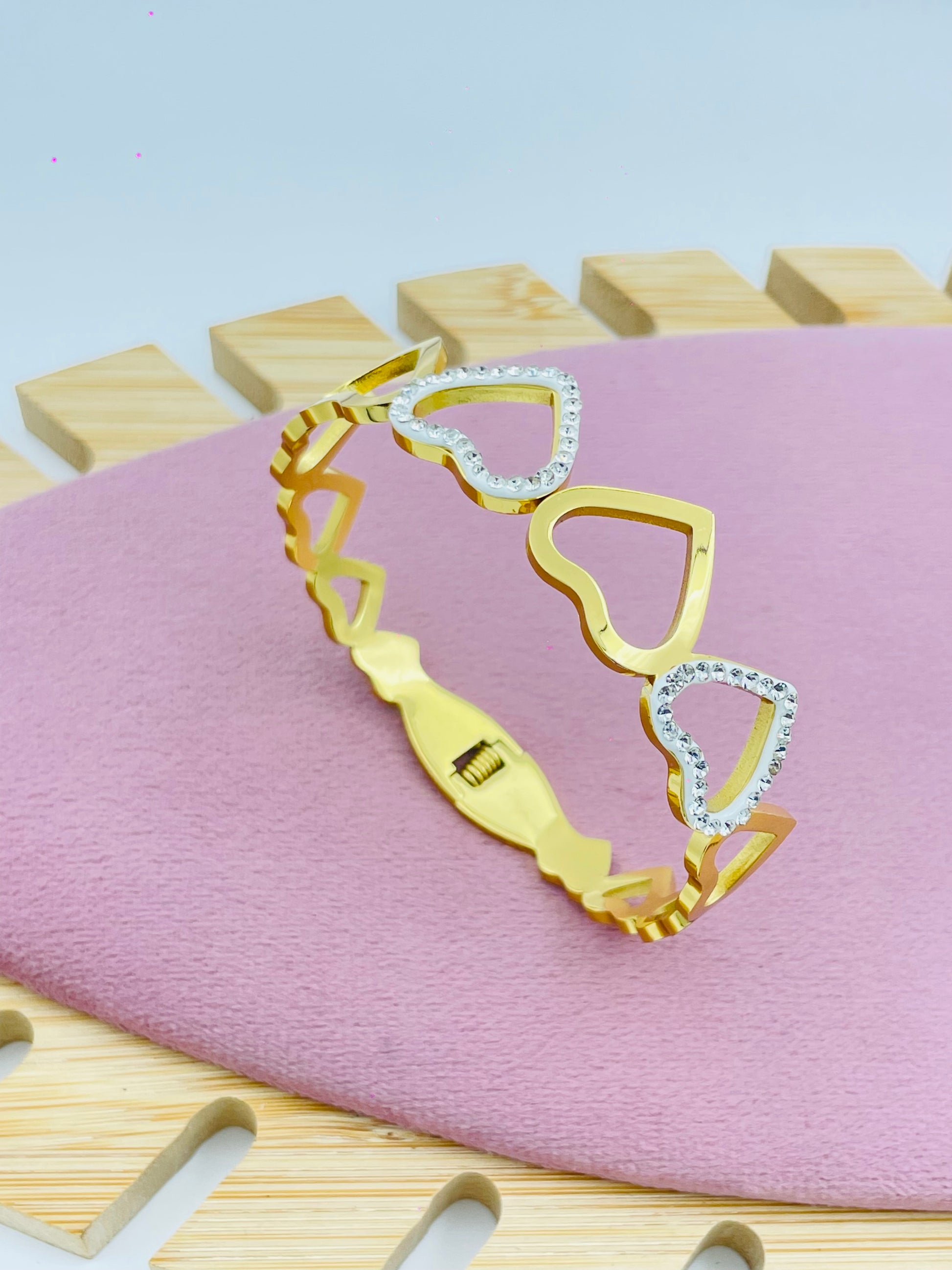 Chic Gold Bangle Bracelet with Crystal Heart Motifs