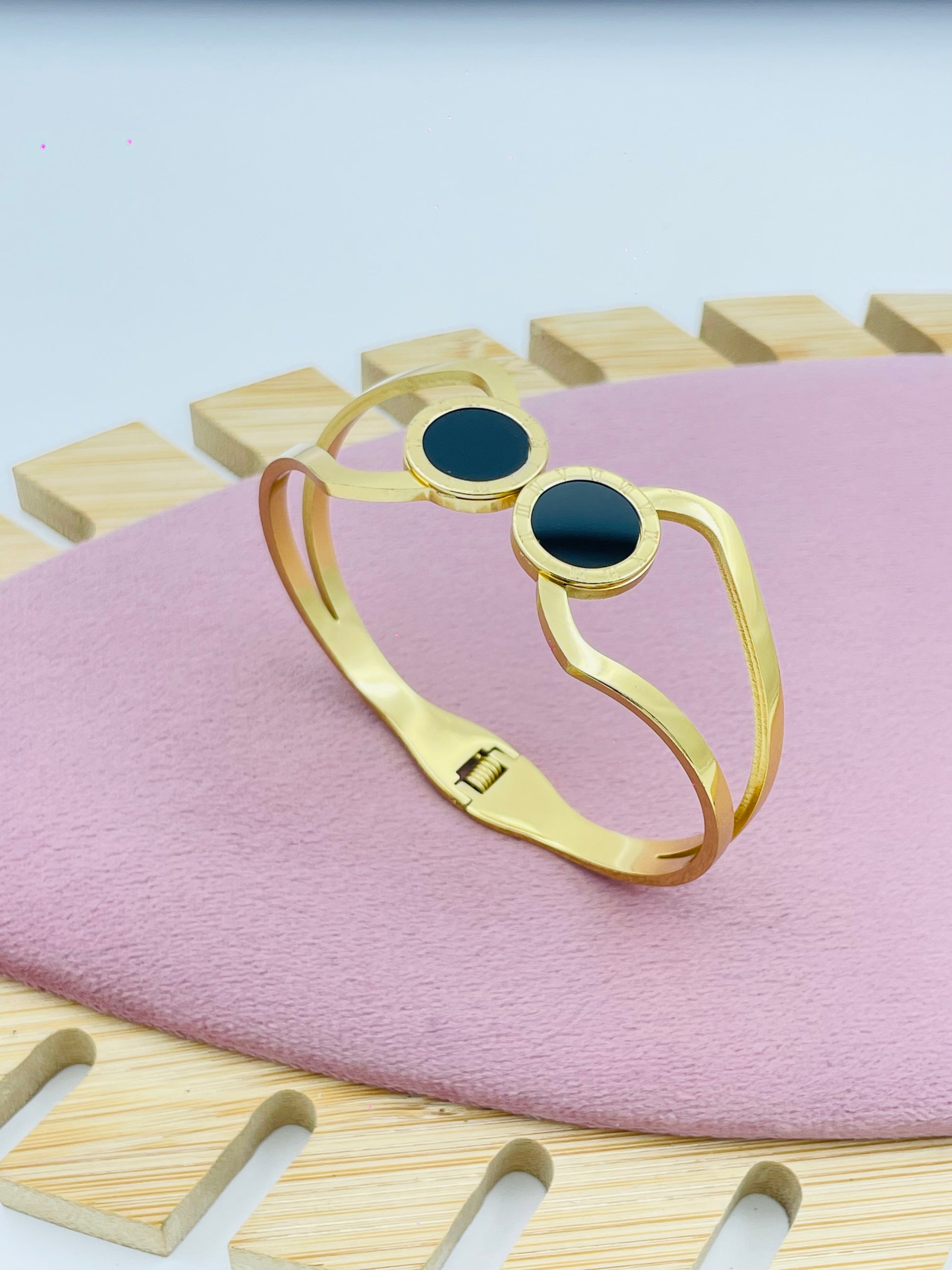 Sleek Gold Bangle with Double Black Stone Accents