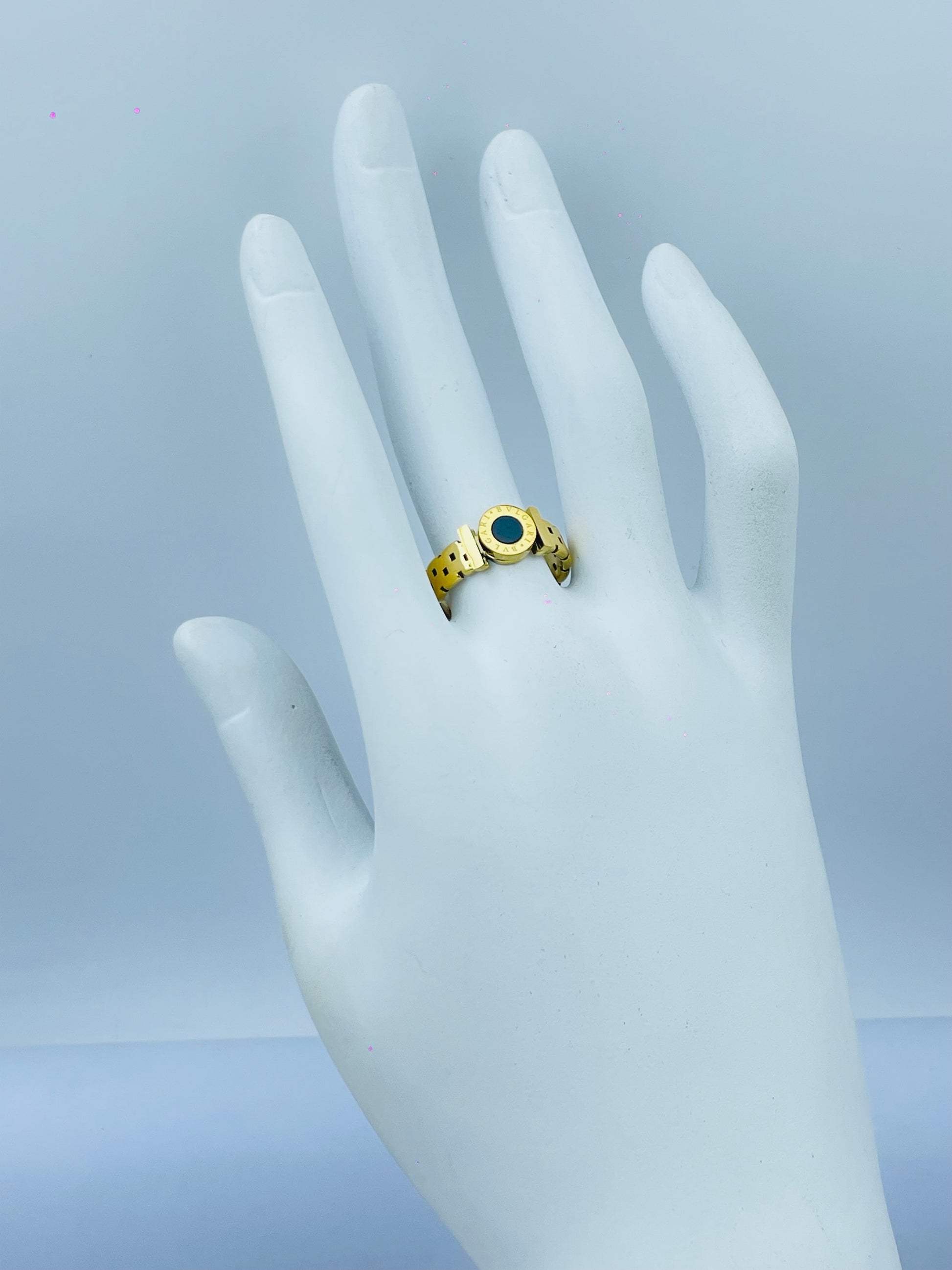 Elegant Gold Plated Ring with Black Enamel Center