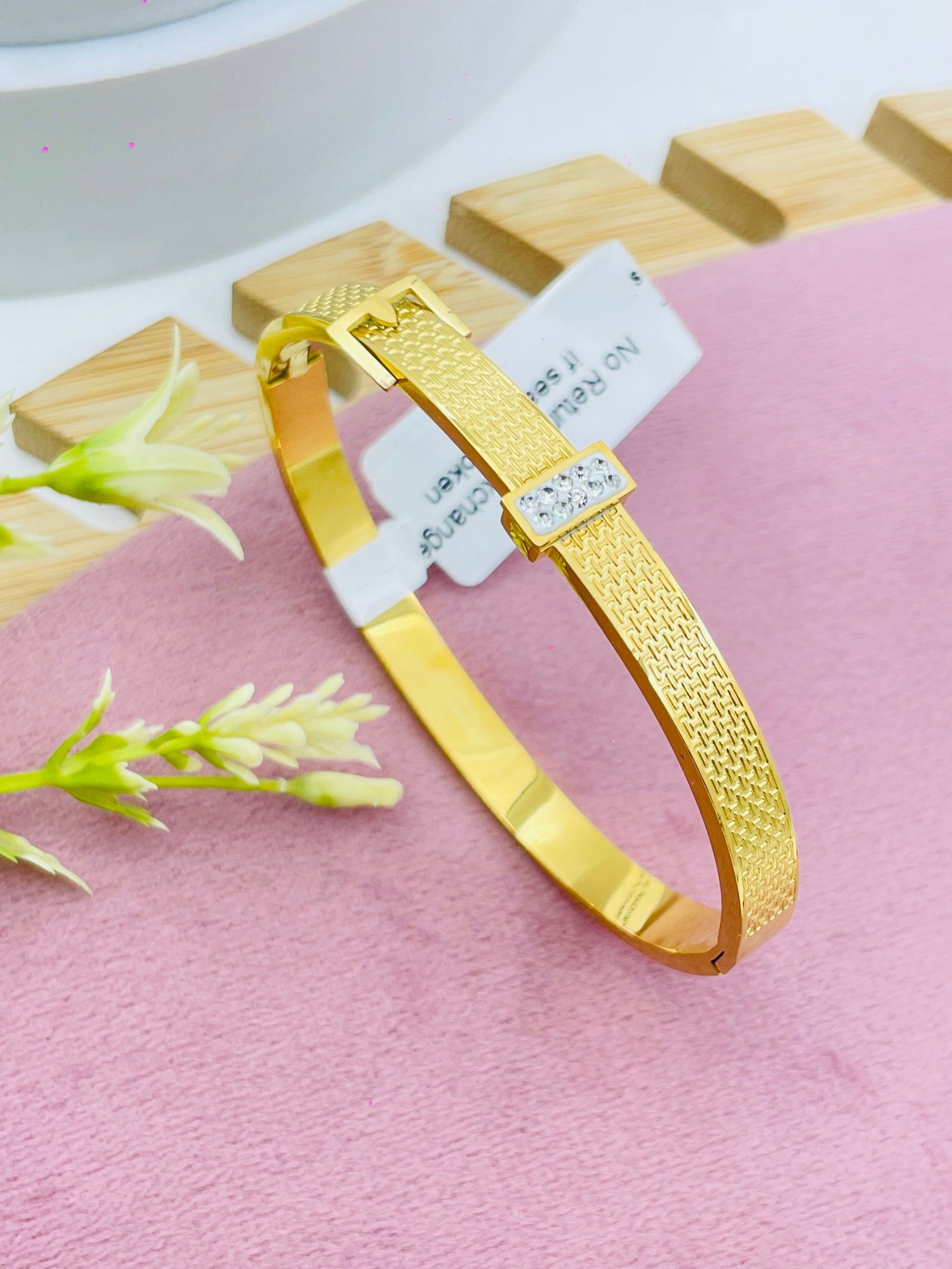 Elegant Gold Textured Bracelet with Rhinestone Accent