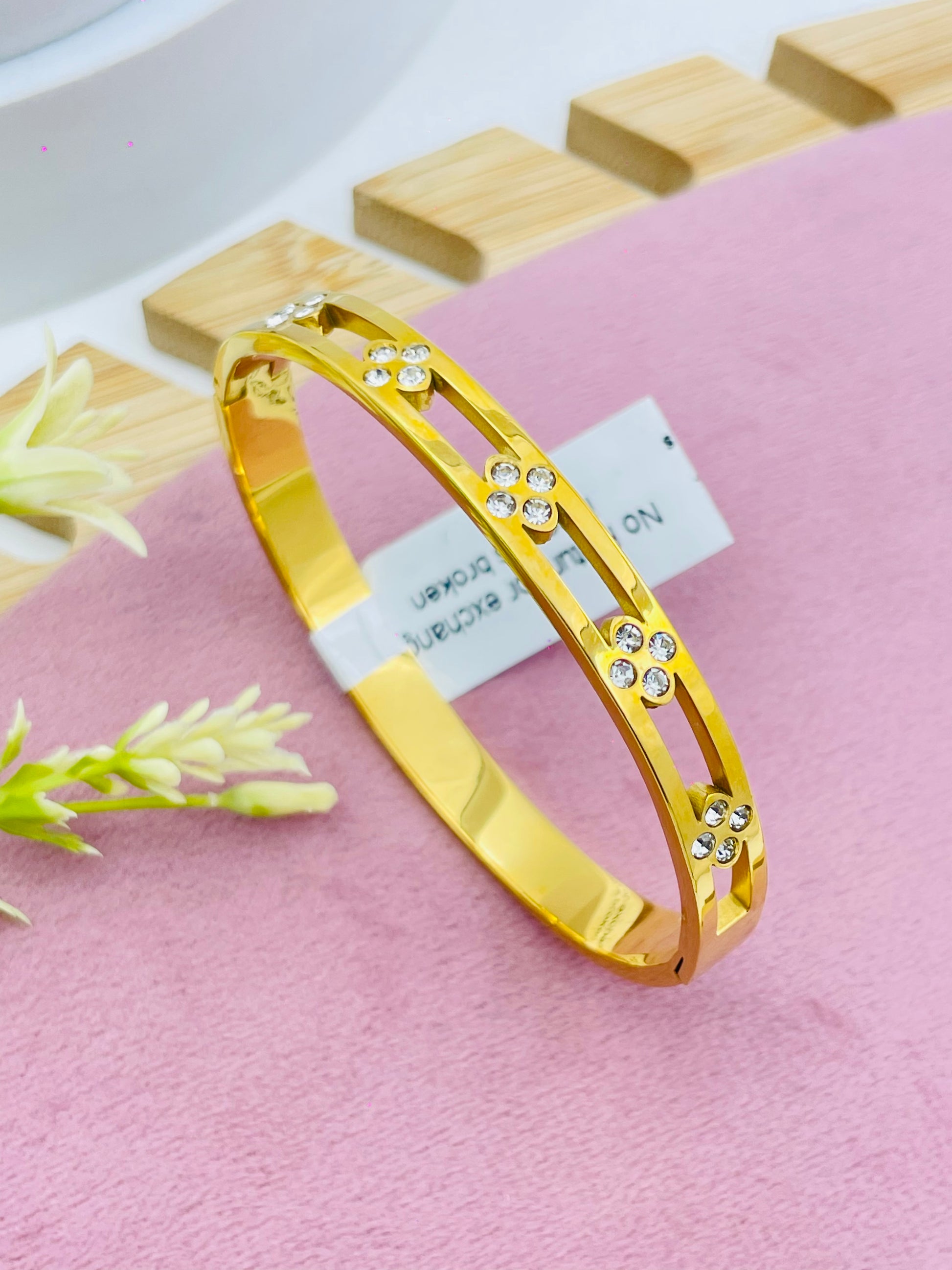 Elegant Gold Floral Bangle with Diamond Accents