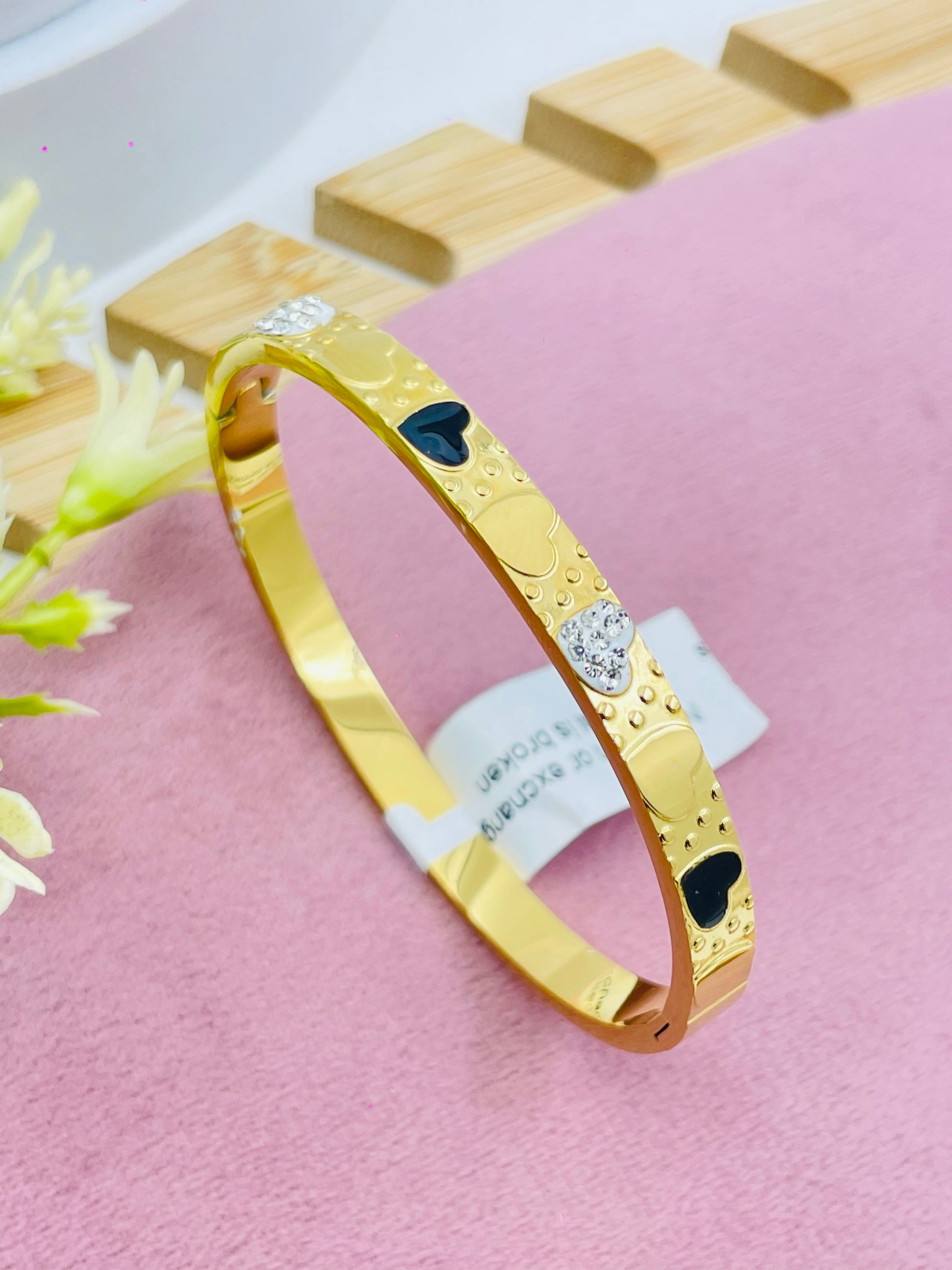 Elegant Gold Heart Bangle with Black and Clear Accents