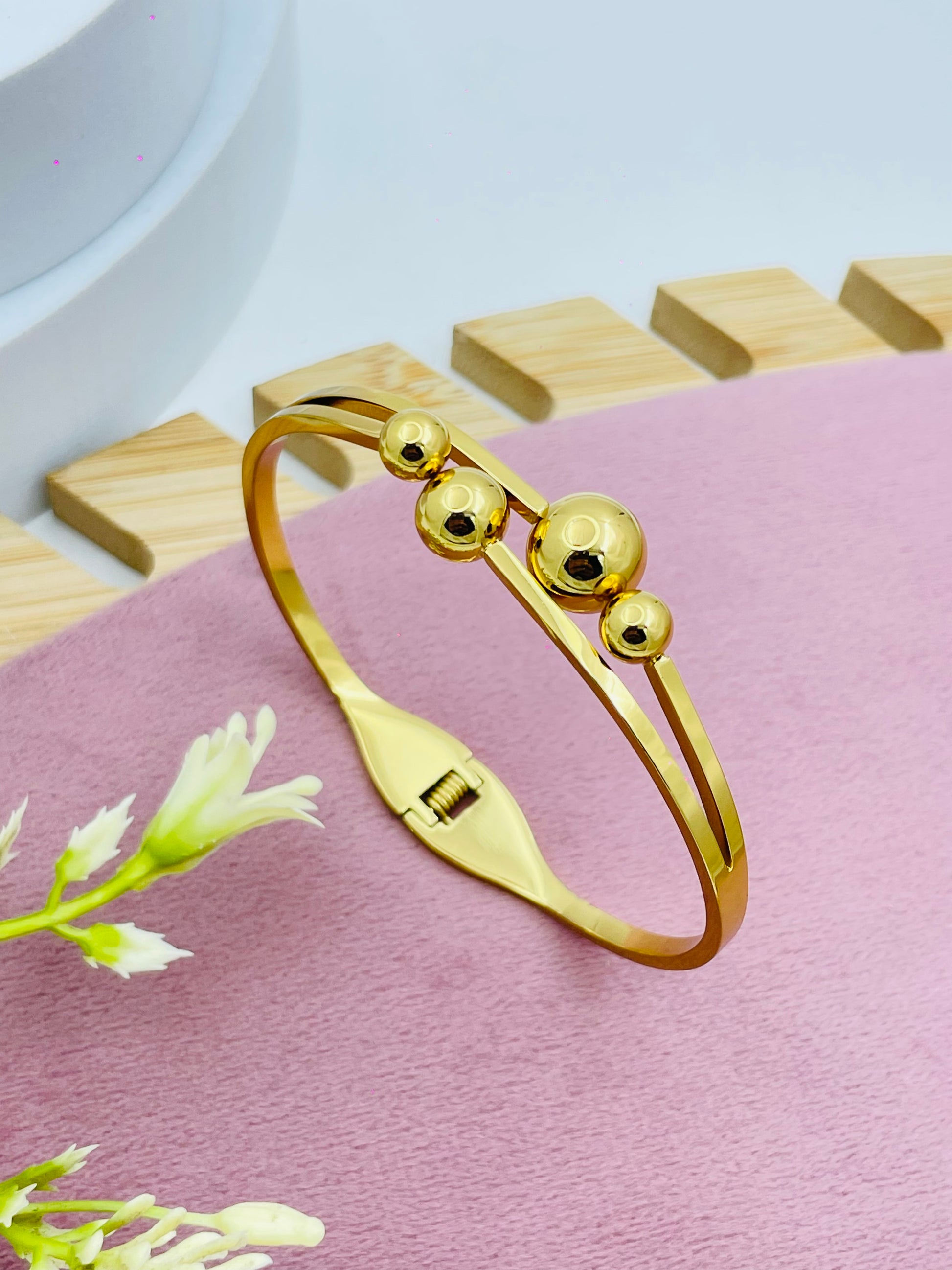 Elegant Gold Bangle with Circular Accents  Perfect for Any Occasion