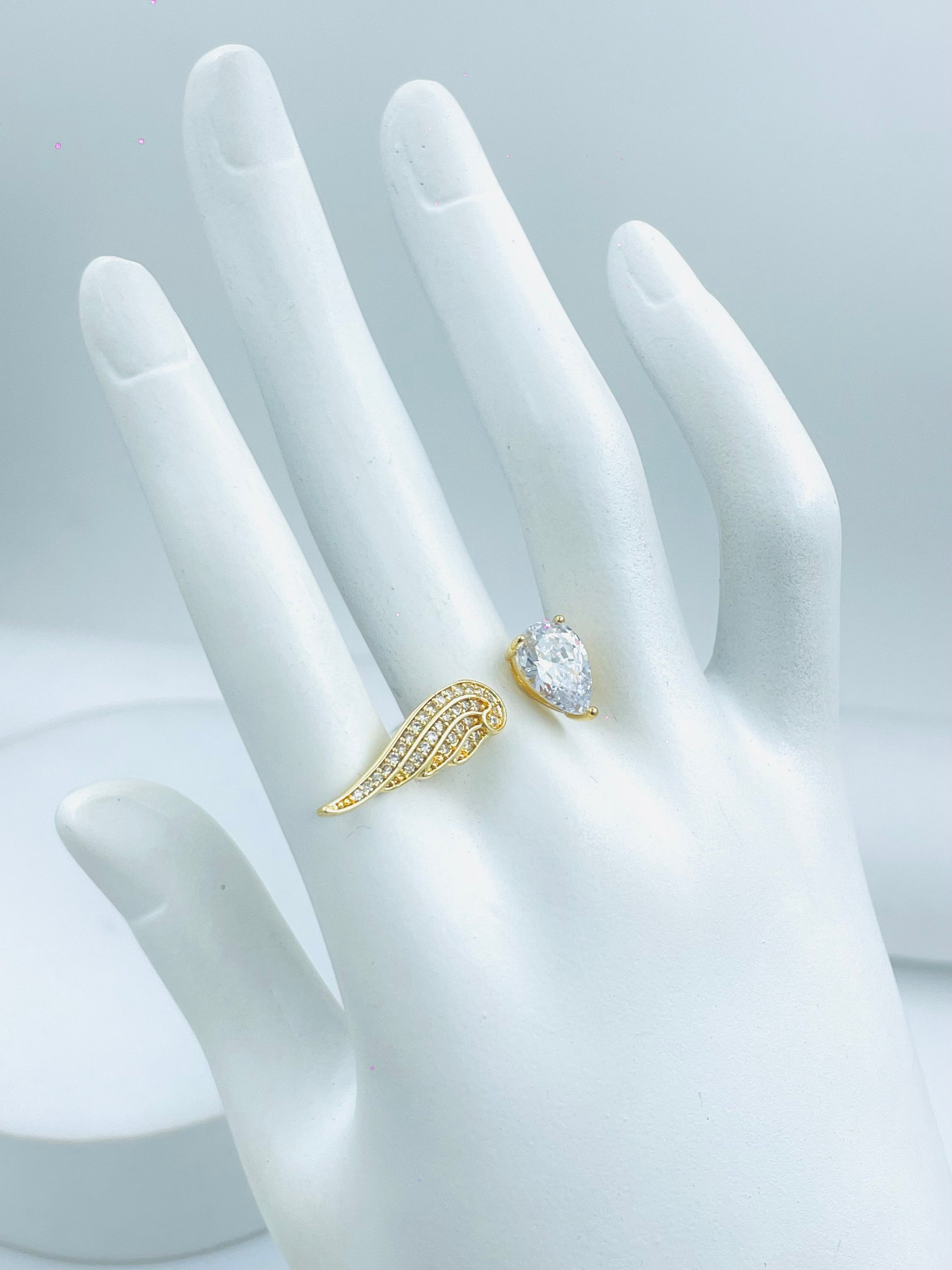 Elegant Gold Wing Design Ring with Teardrop Gemstone