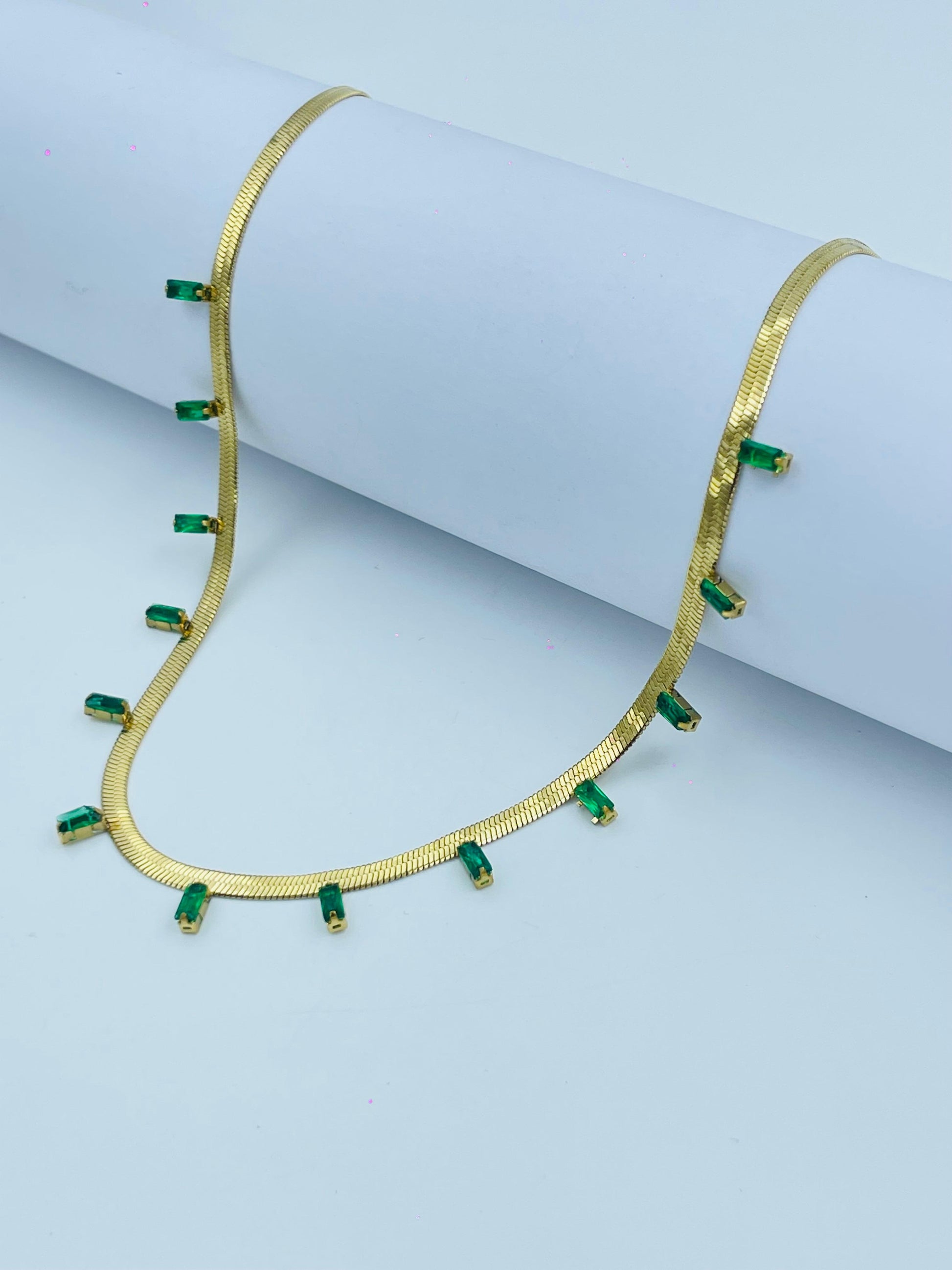 Gold Herringbone Necklace with Emerald Green Baguette Charms – Sophisticated Shine