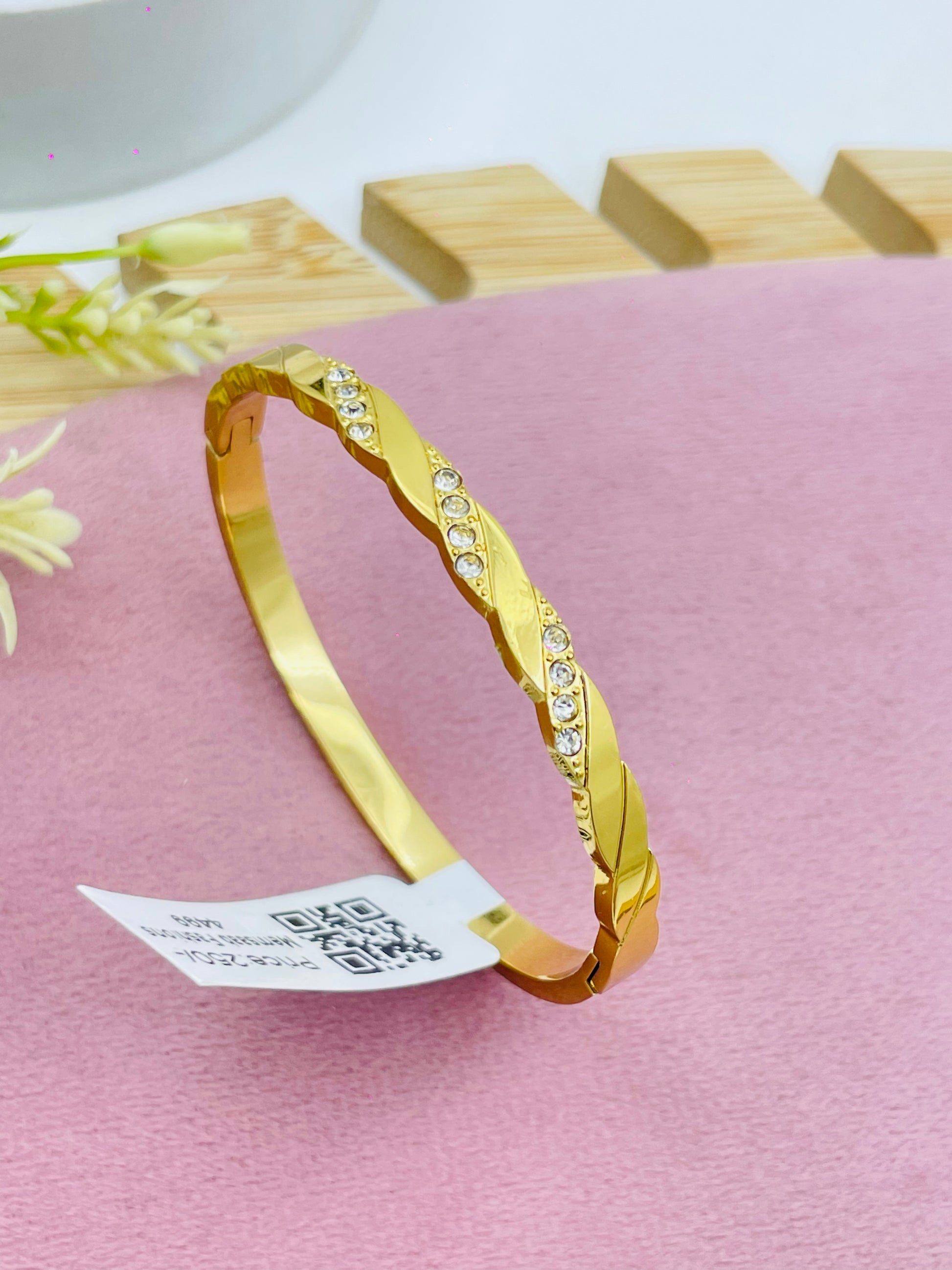 Elegant Gold and Diamond Twist Bracelet
