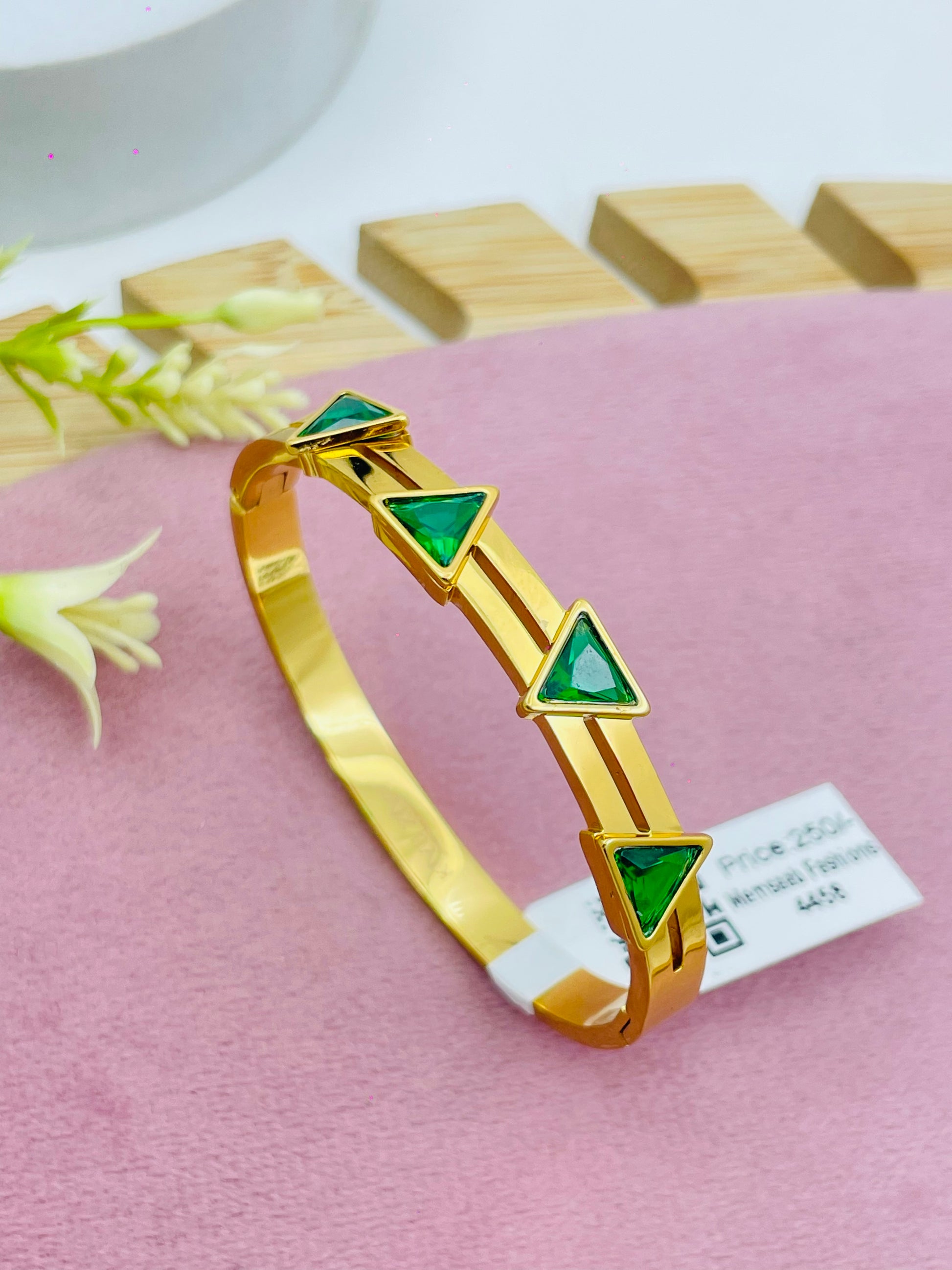 Elegant Gold Bracelet with Green Triangle Stones