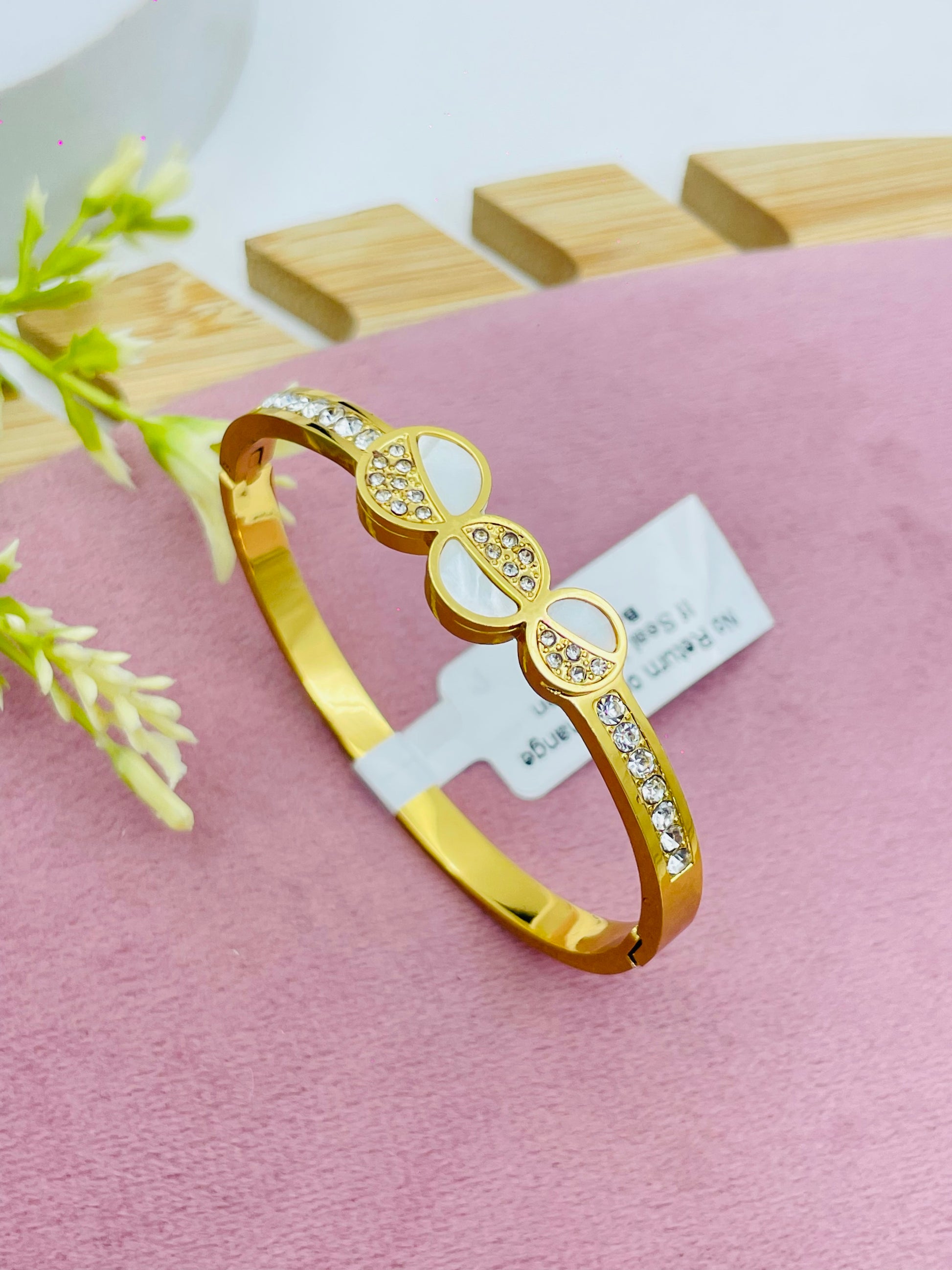 Elegant Gold Bangle with Diamond Accents  Glamorous Jewelry