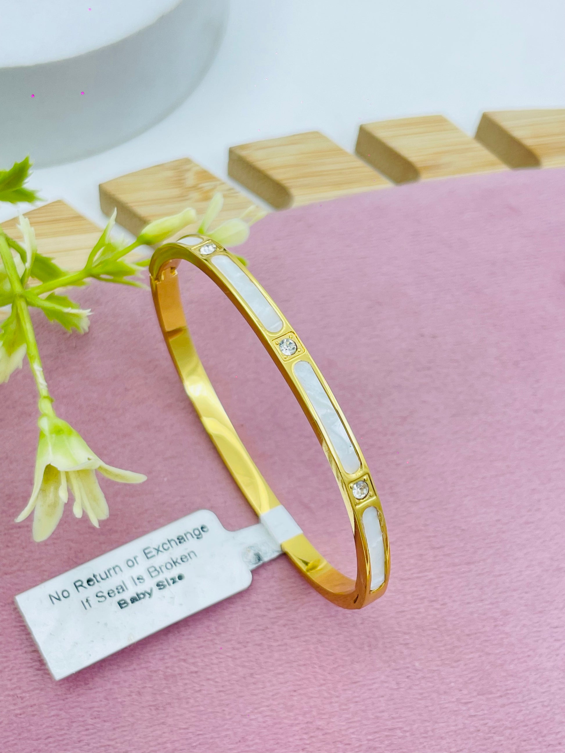 Elegant Gold and Pearl Bangle Bracelet with Diamond Accents