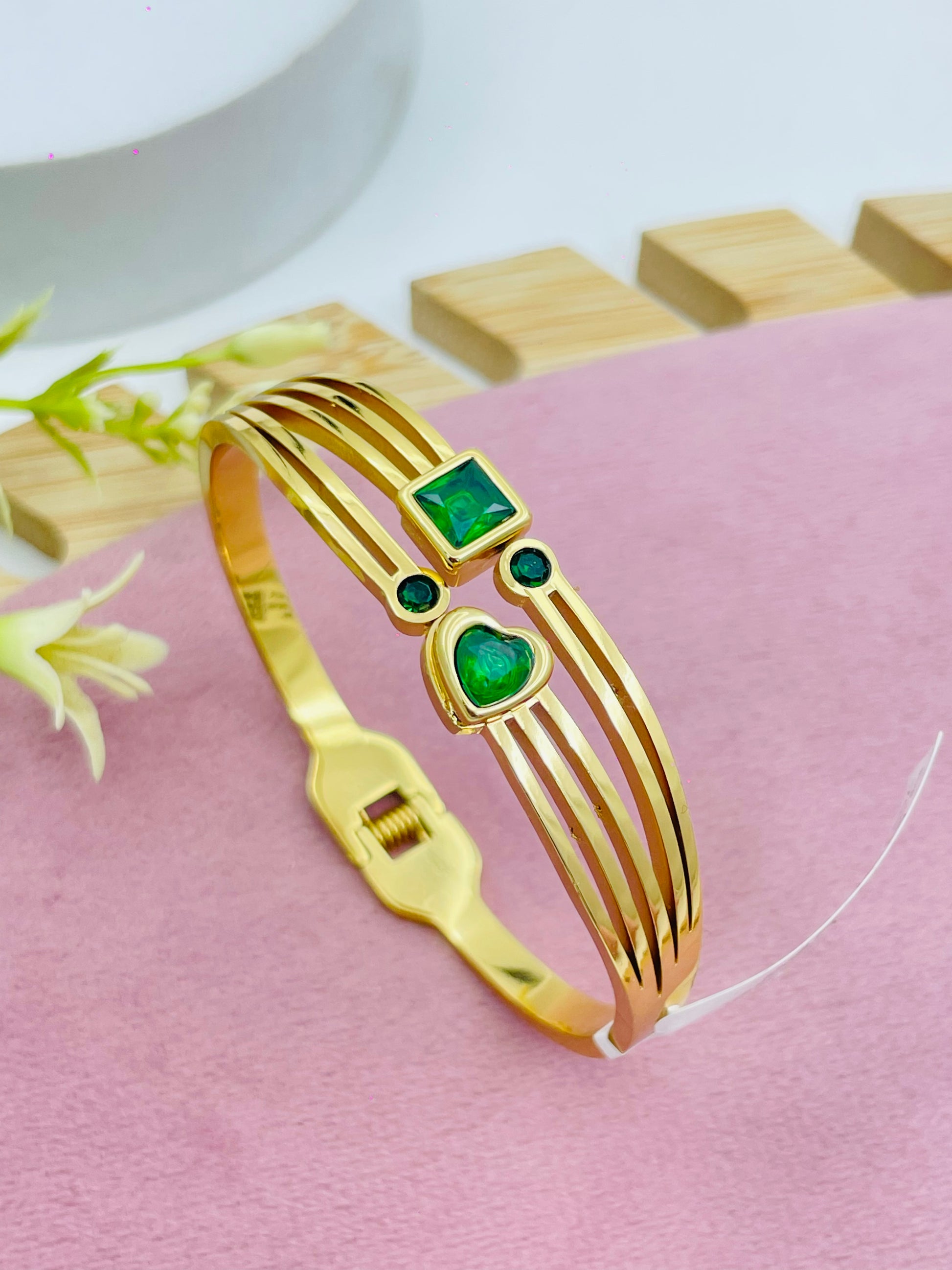 Elegant Gold Bangle with Green Gemstones  Fashion Jewelry