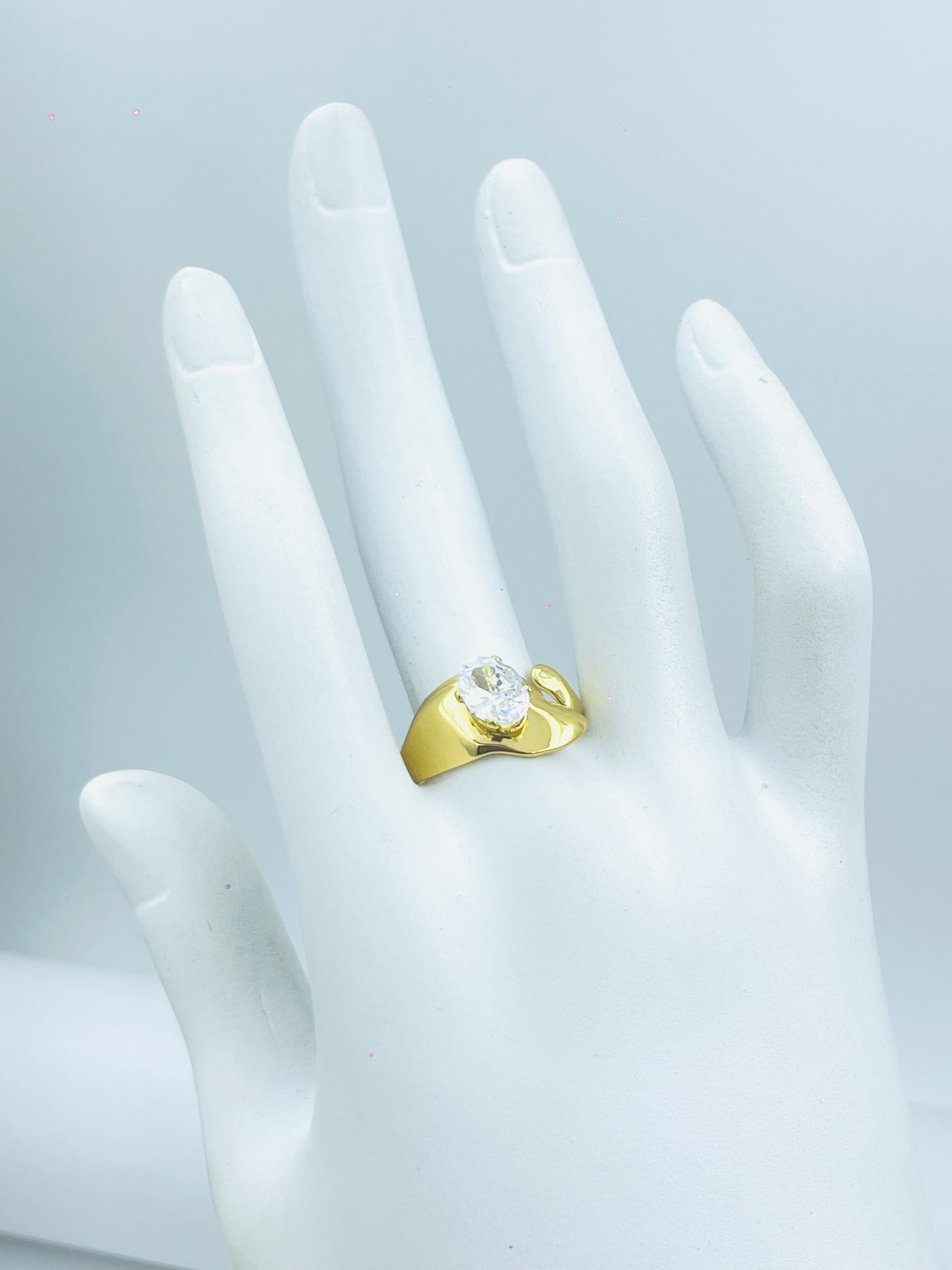 Elegant Gold Ring with Central Stone