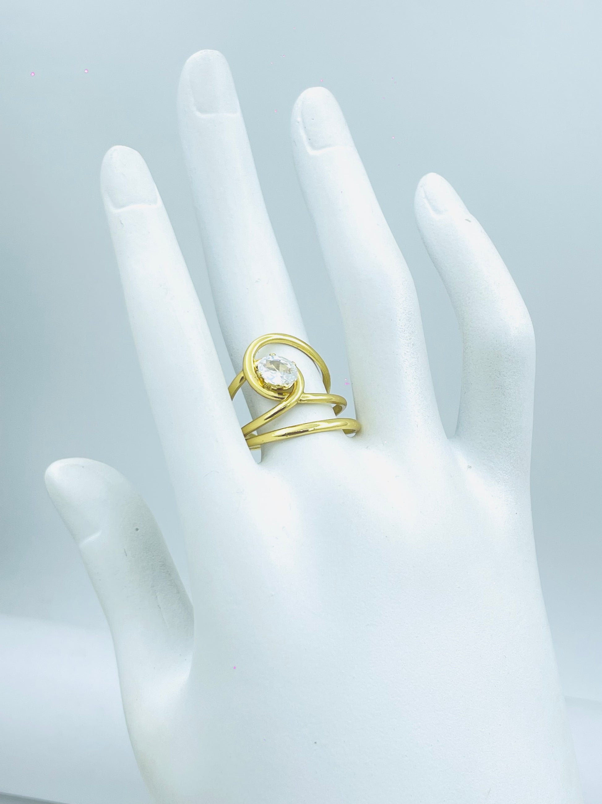 Elegant Gold Swirl Ring with Clear Gem
