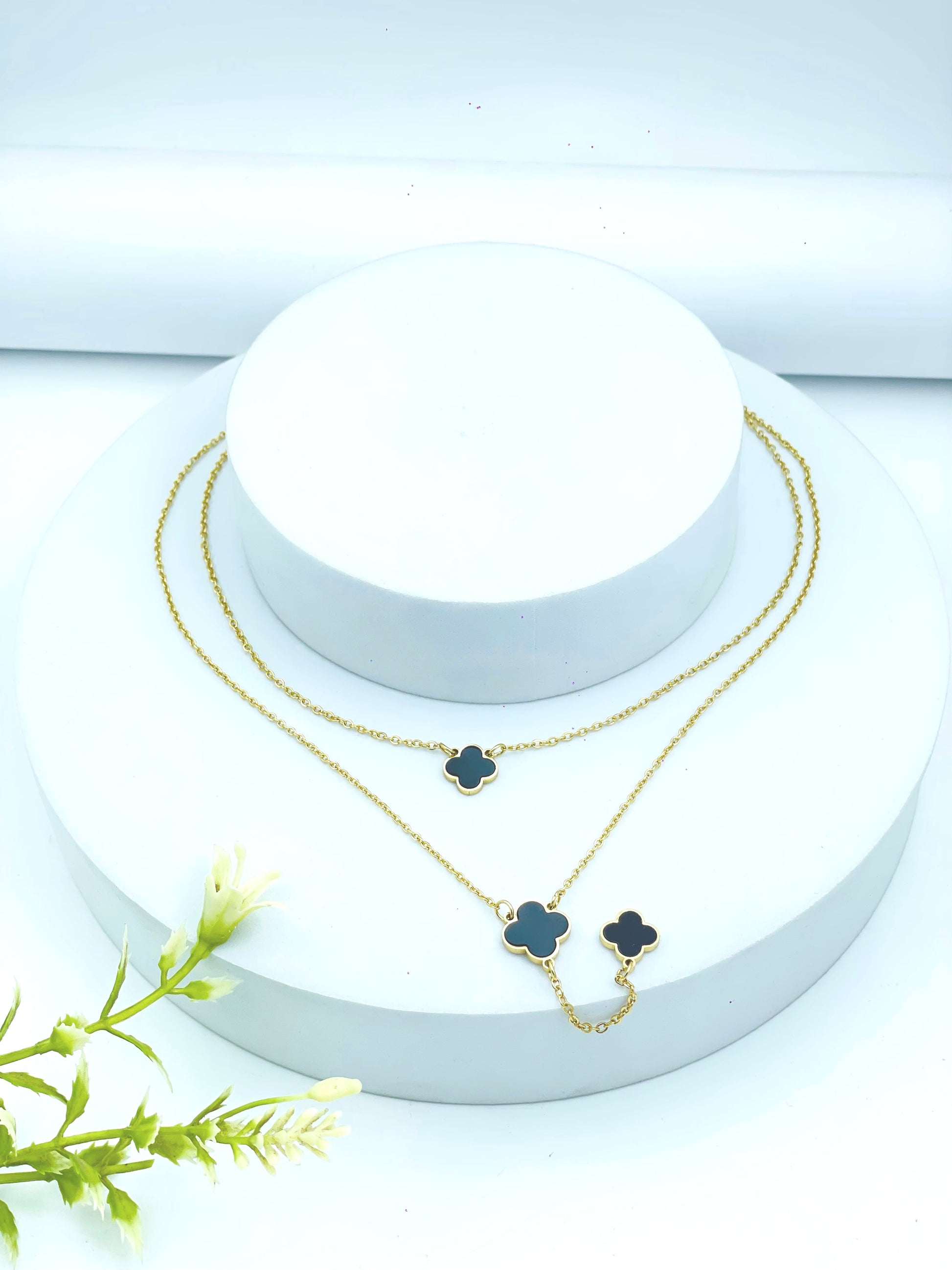Elegant Gold Clover Necklace with Black Inlays