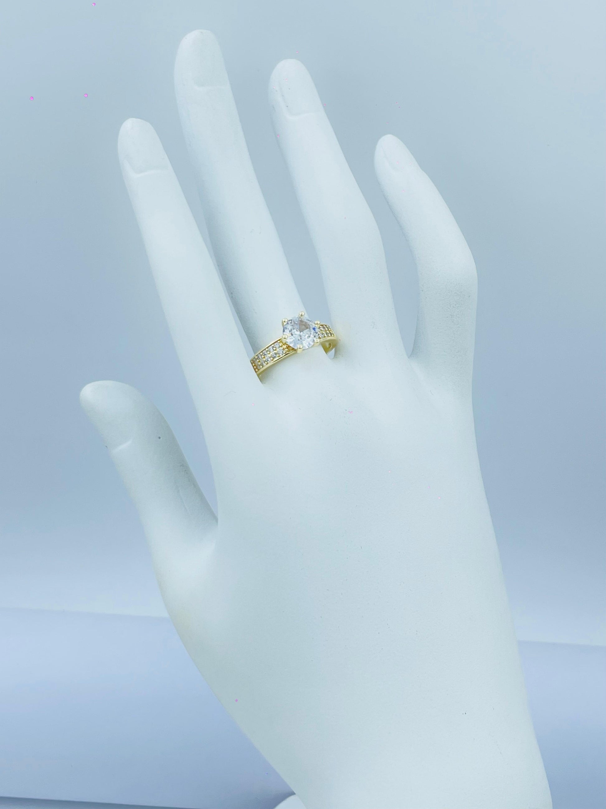 Gold Ring with Shiny Stone and Side Detailing