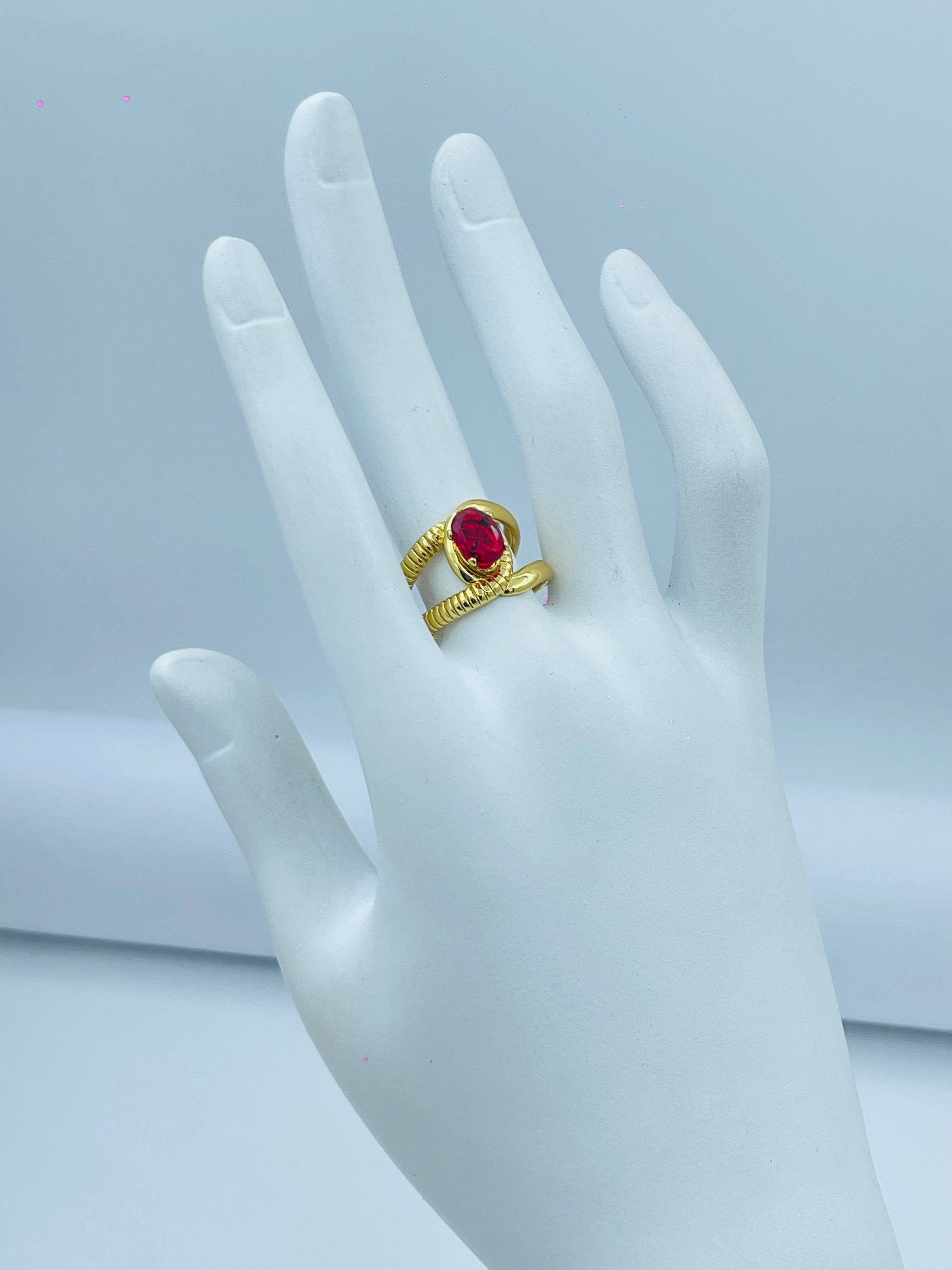 Elegant Gold Ring with Red Gemstone