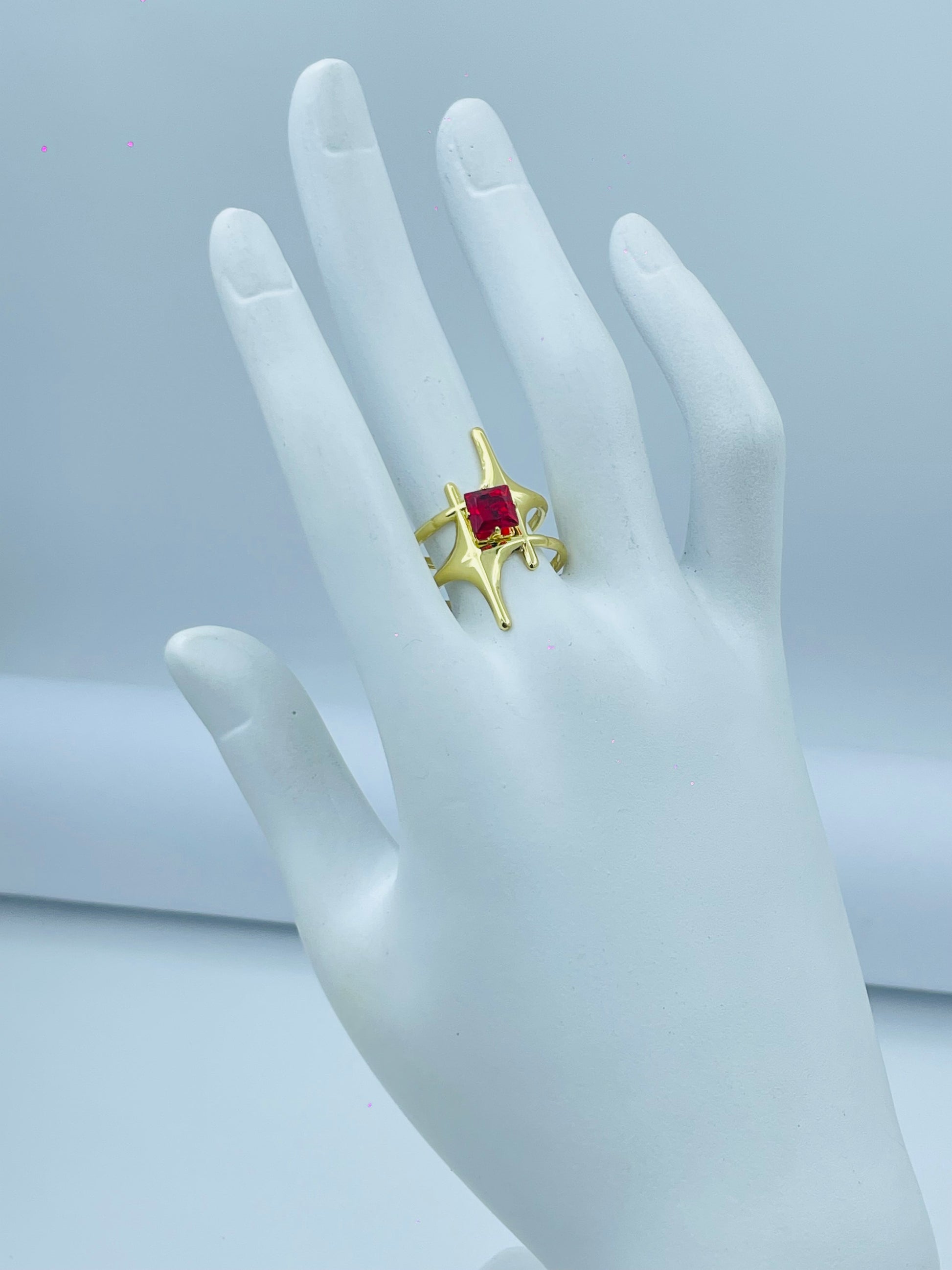 Elegant Gold Ring with Red Gemstone