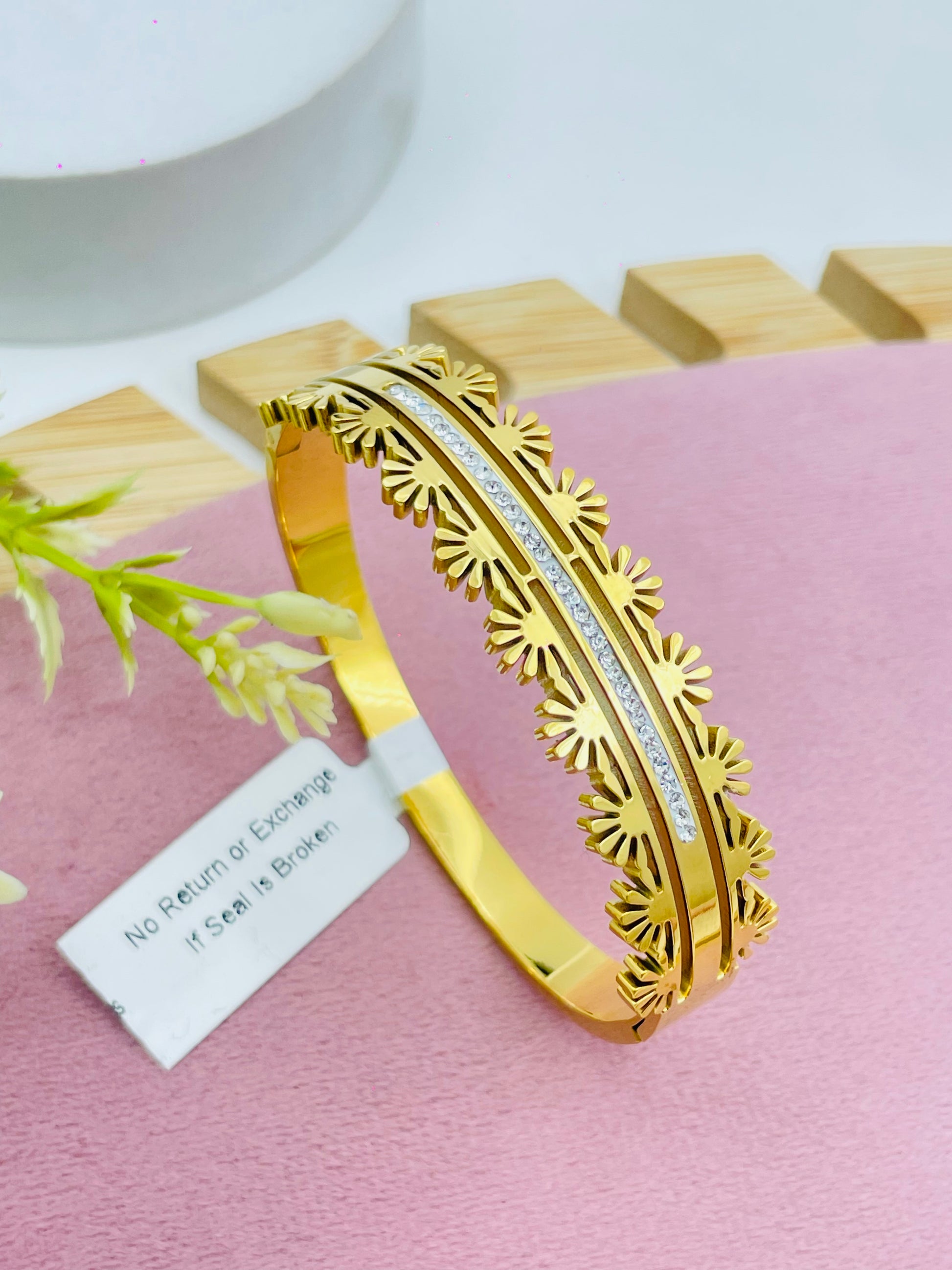 Elegant Gold Floral Bangle with Diamond Accents