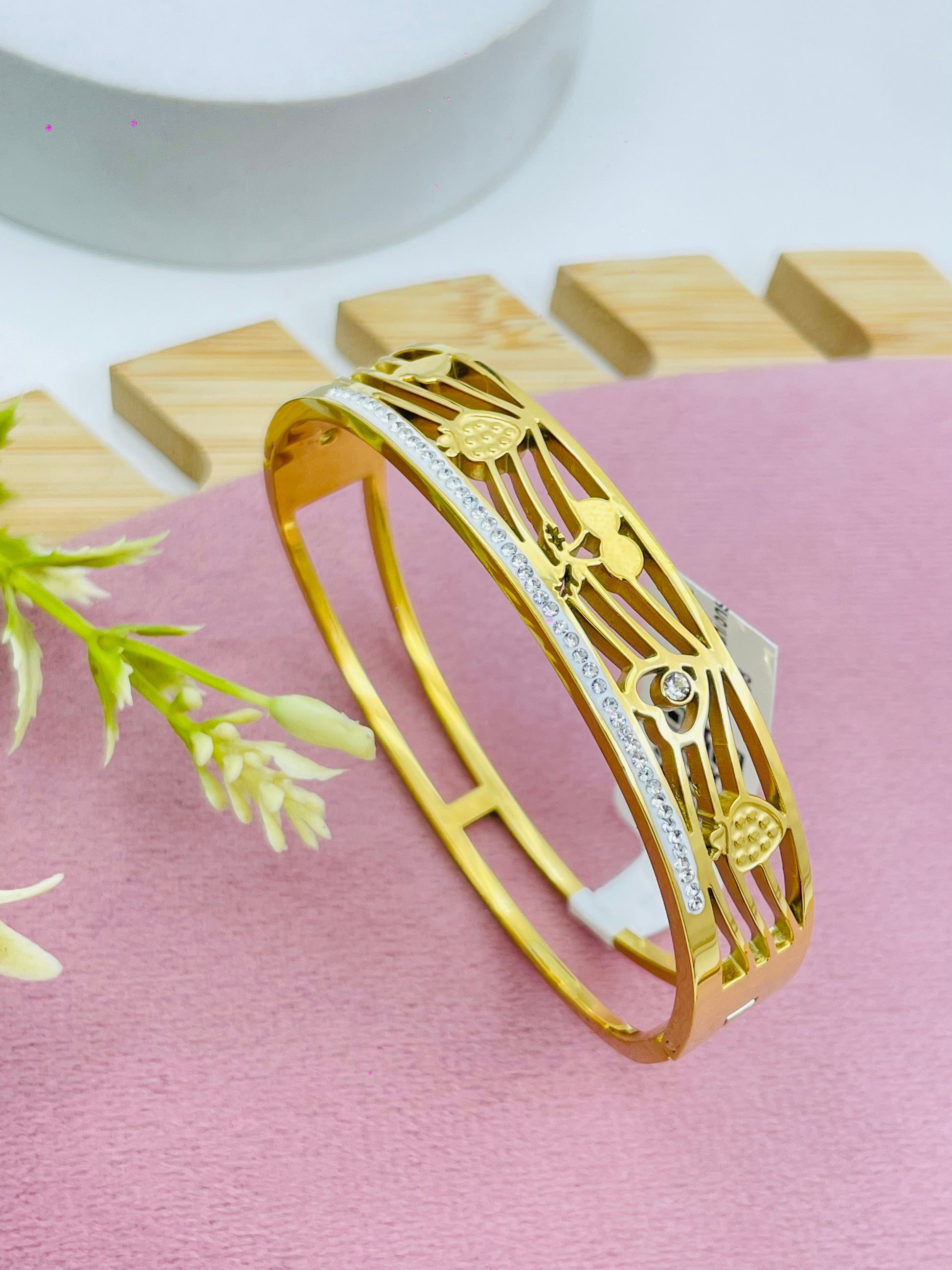 Elegant TwoTone Gold and Silver Bangle with Leaf and Heart Design