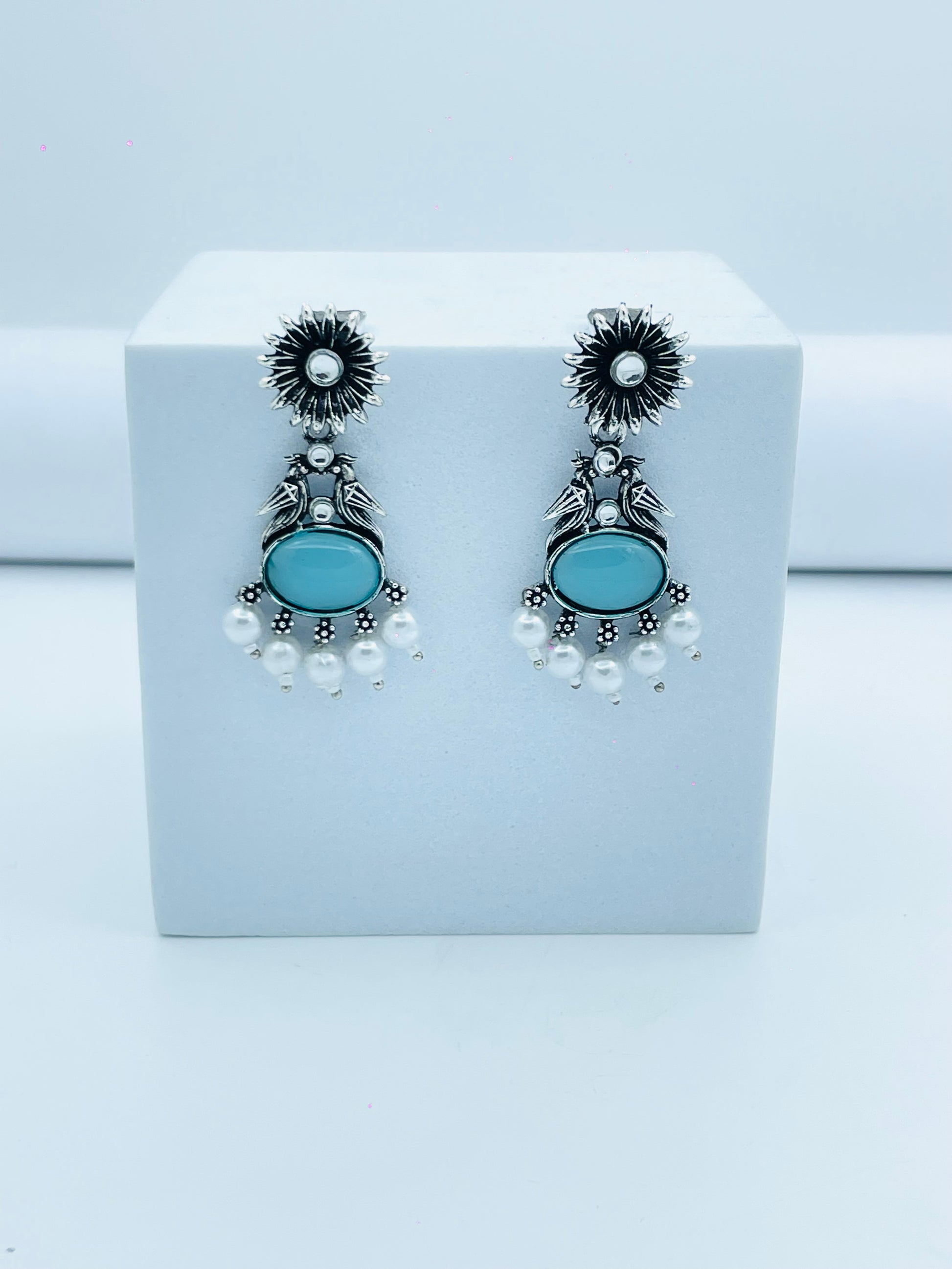 Elegant Silver Dangle Earrings with Blue Stone