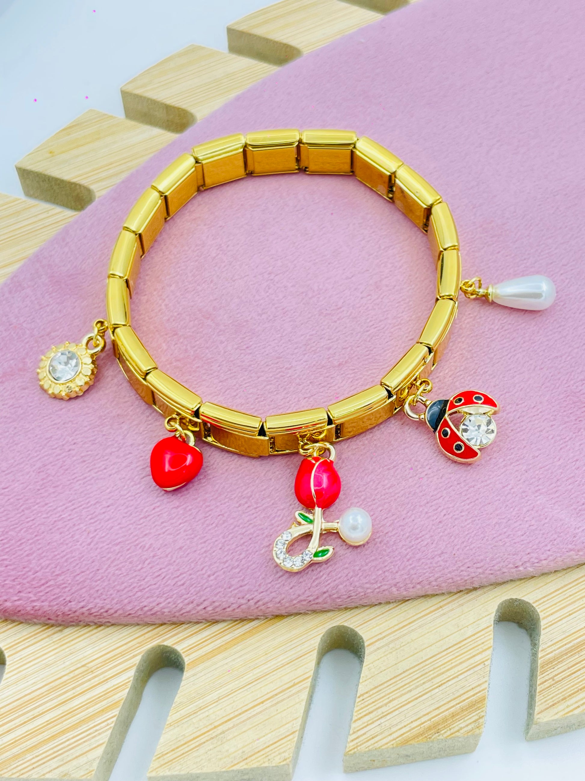Stylish Gold Charm Bracelet with Enamel Accents