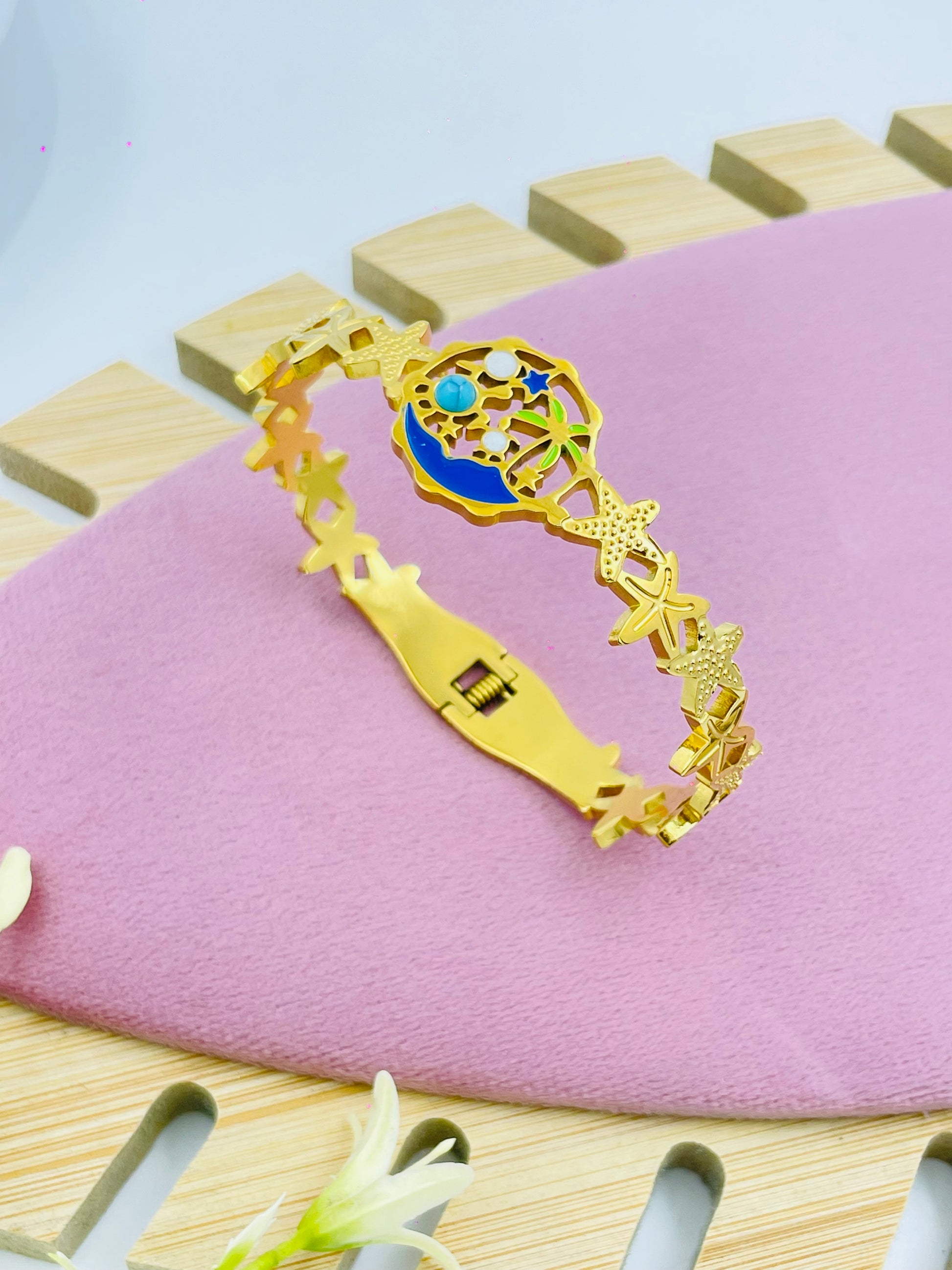 Elegant Gold Enamel Bracelet with Blue Center