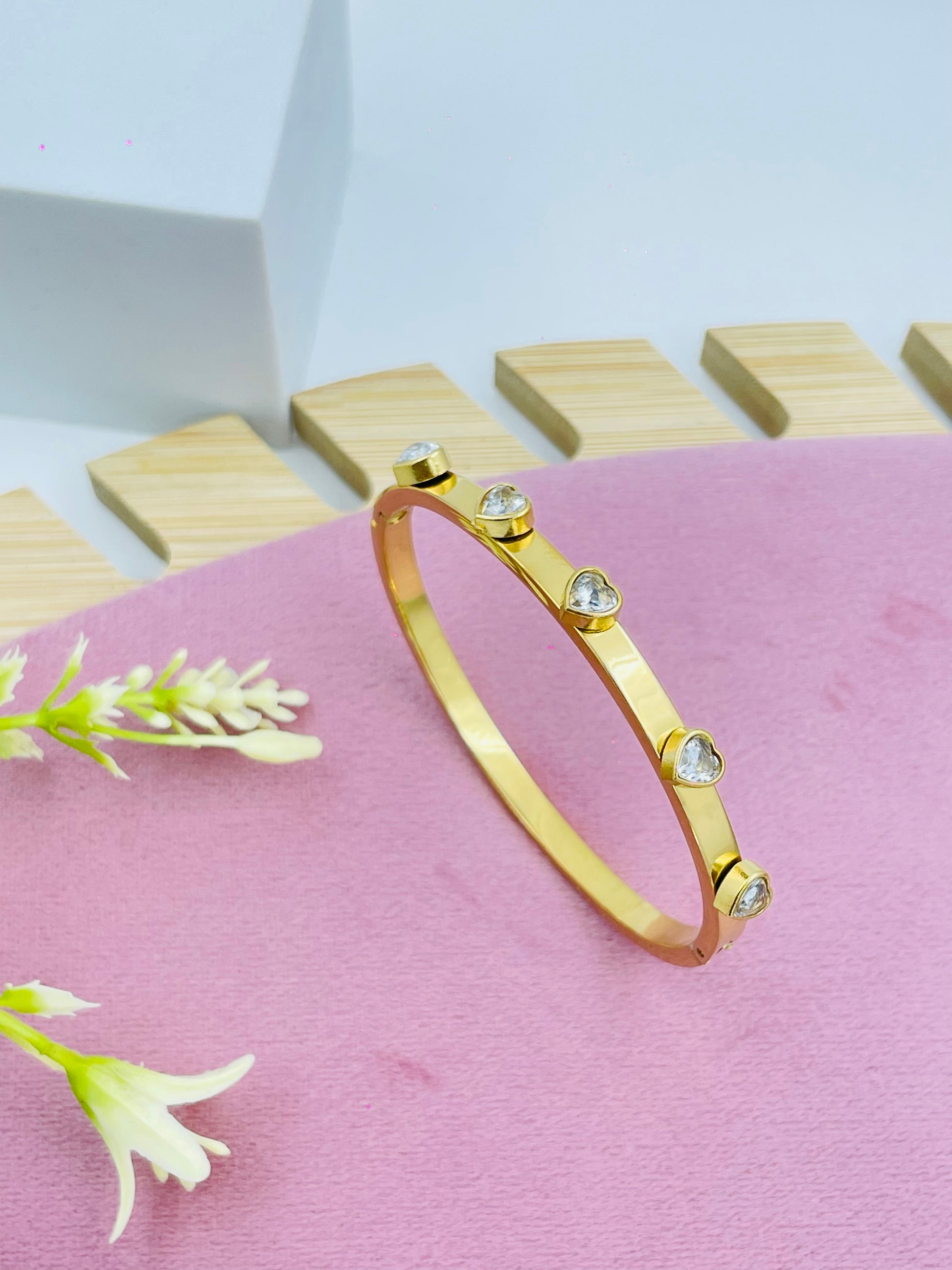 Elegant Gold Bangle with Sparkling Diamond Accents