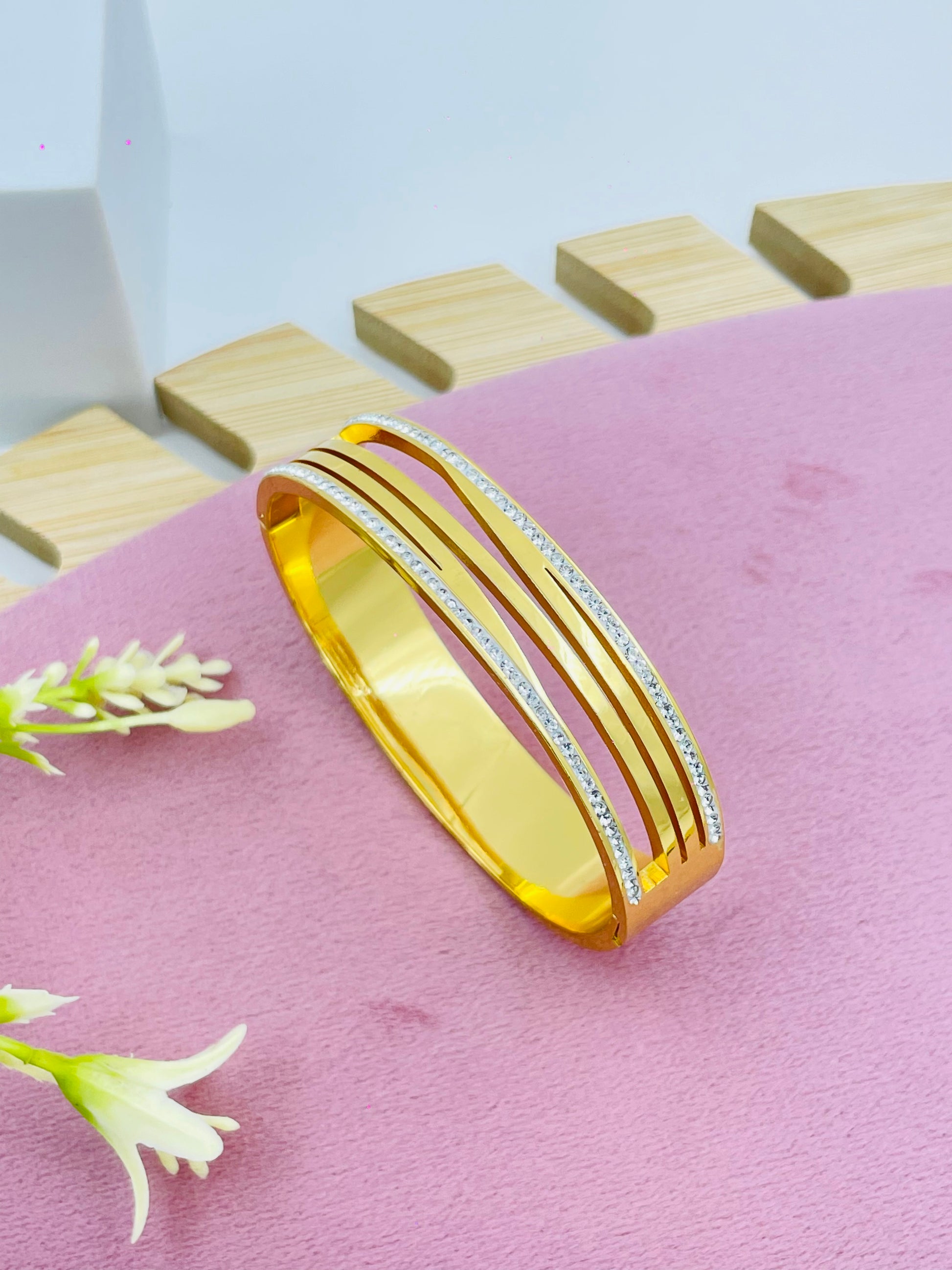 Elegant Gold Bangle with Diamond Accents