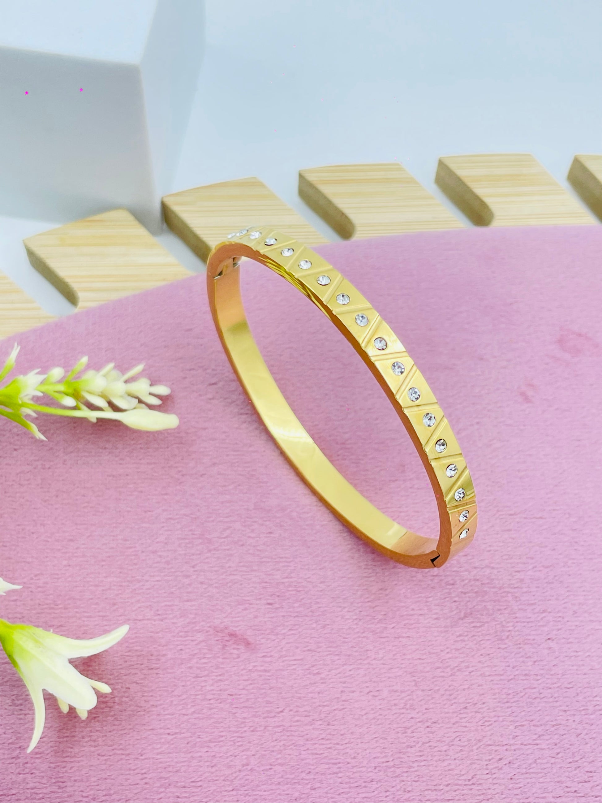 Elegant Gold Bangle Bracelet with Studded Accents