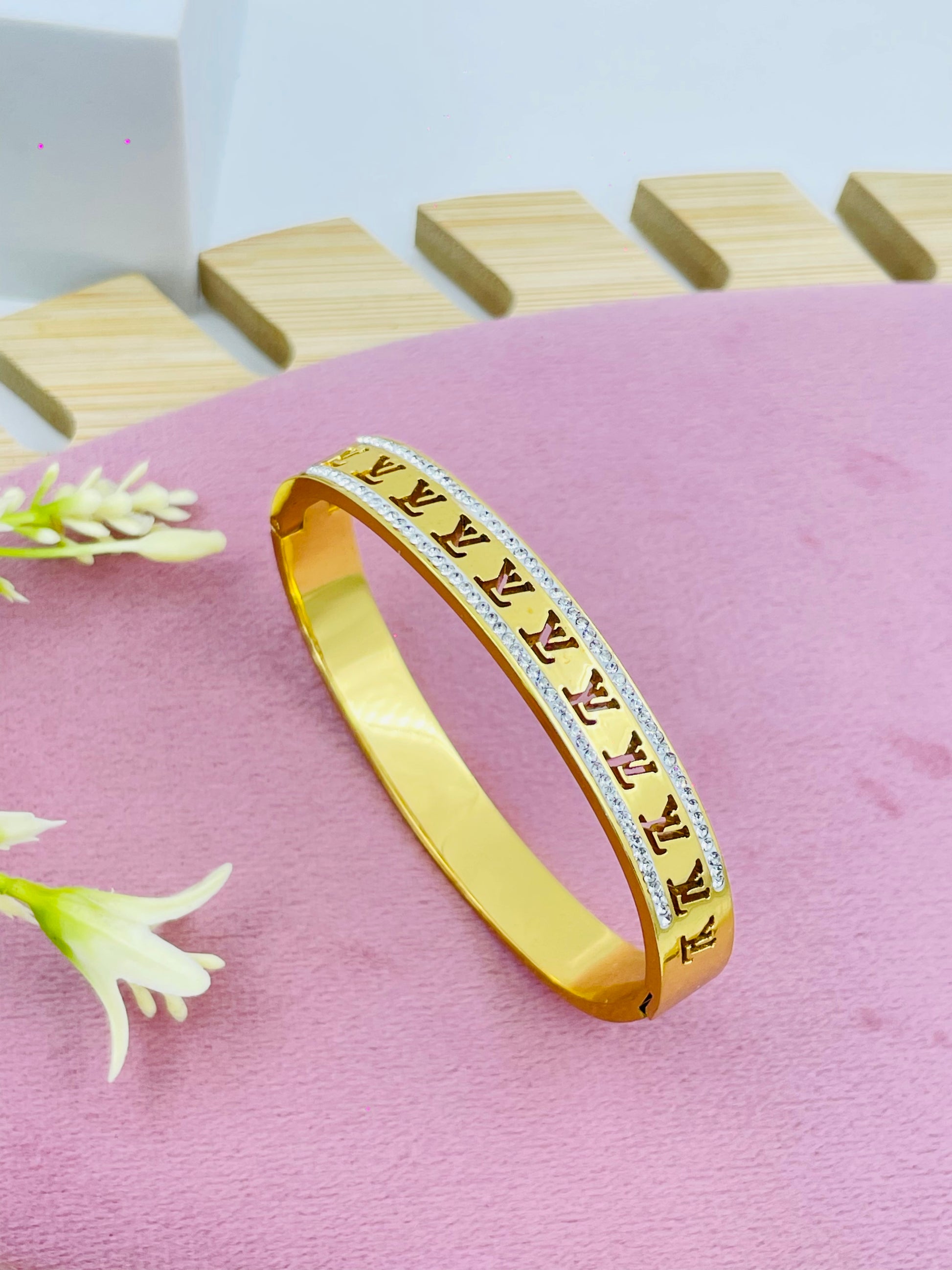 Elegant Gold Bangle with Diamond Accents
