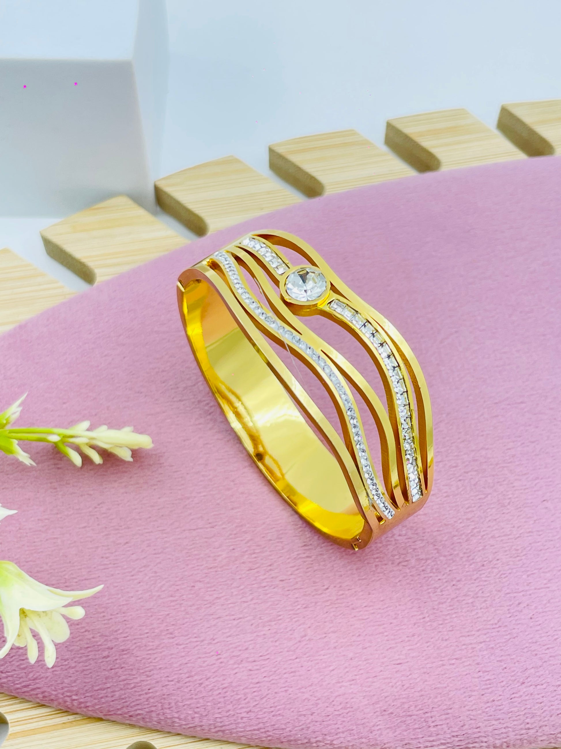 Elegant Gold Wave Bracelet with Crystal Accents