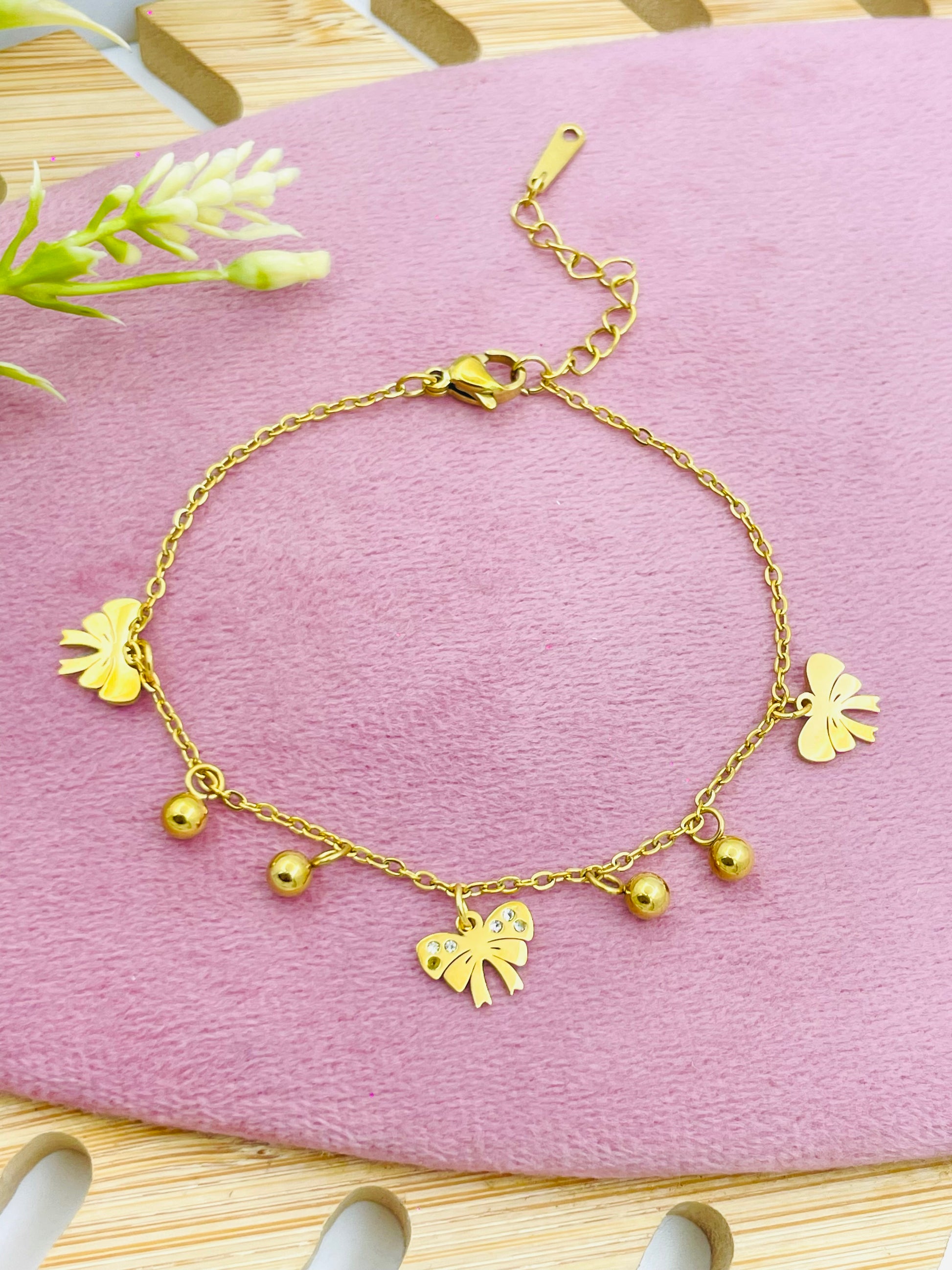 Gold Charm Bracelet with Butterfly and Bead Accents